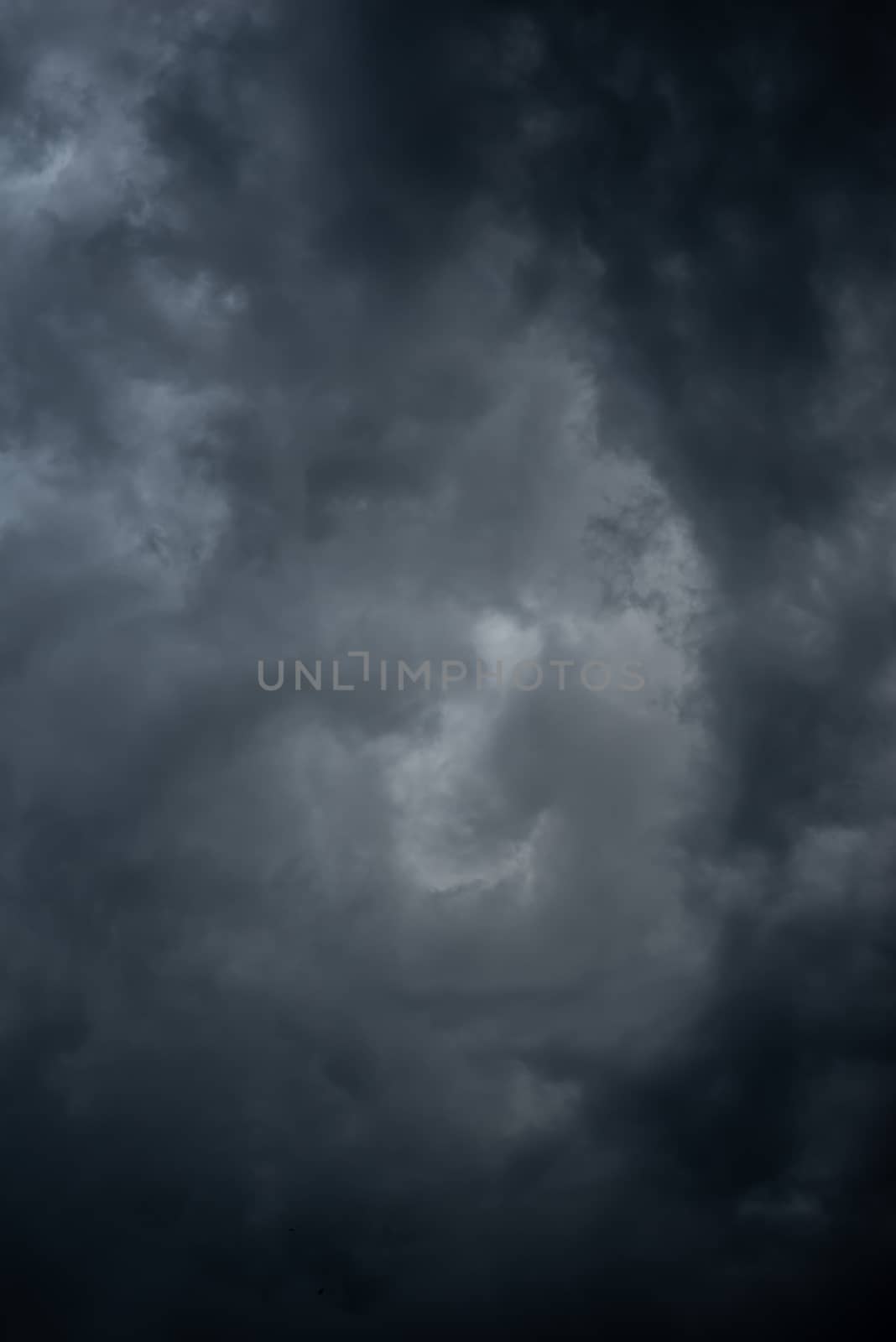 Dark black clouds in the sky, Stormy rain clouds background.