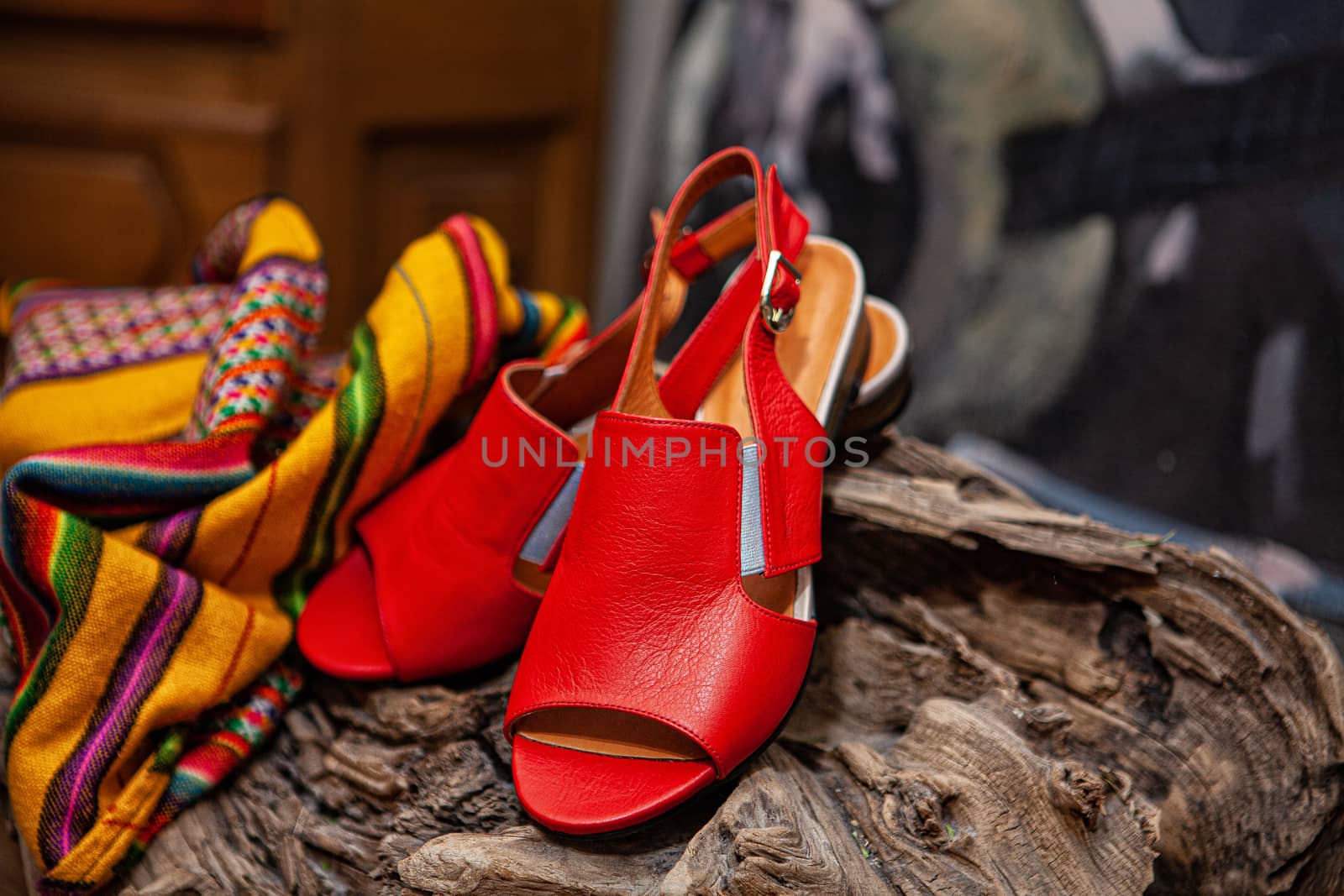 Different shoes with accessories on a studio background