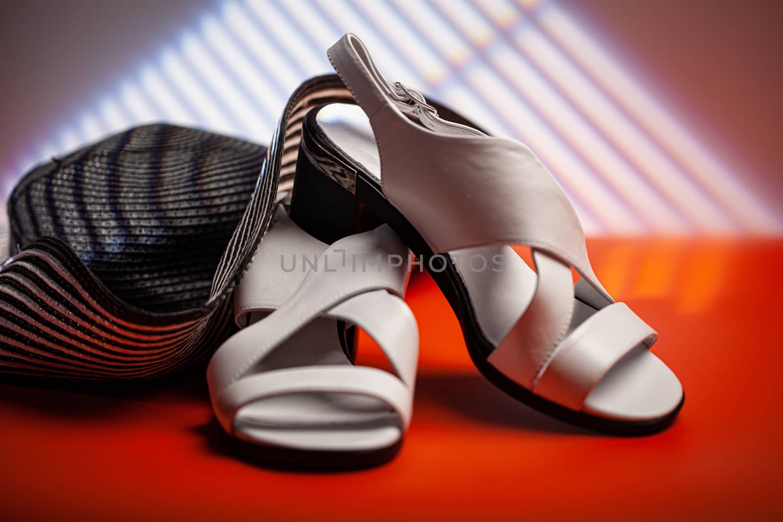 Woman's shoes and accessories on a studio background