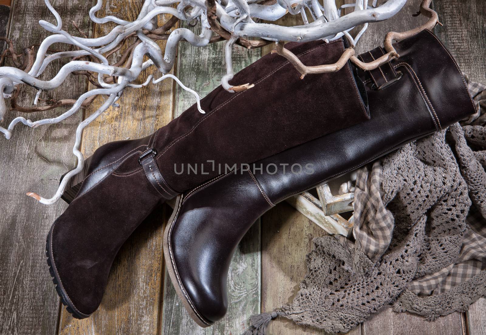 Different kinds of shoes on a wooden desk