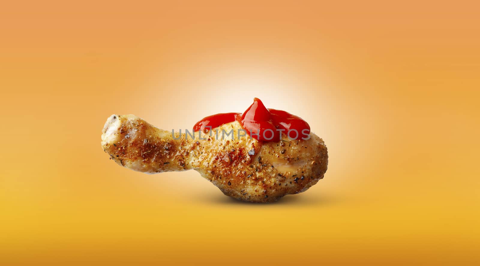 Baked chicken leg ketchup sauce spices isolated on orange backgr by SlayCer