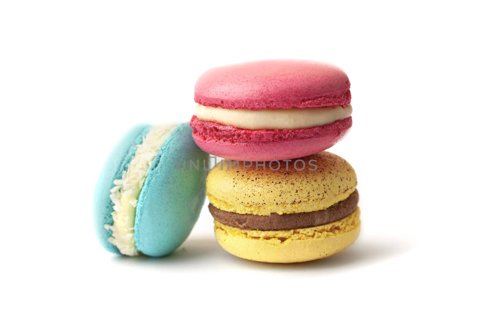 Colorful macarons cakes. Small French cakes. Sweet and colorful french macaroons isolated on white background