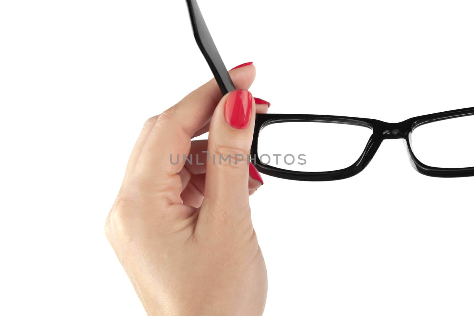 Female hand holding a black-framed glasses isolated on white bac by SlayCer