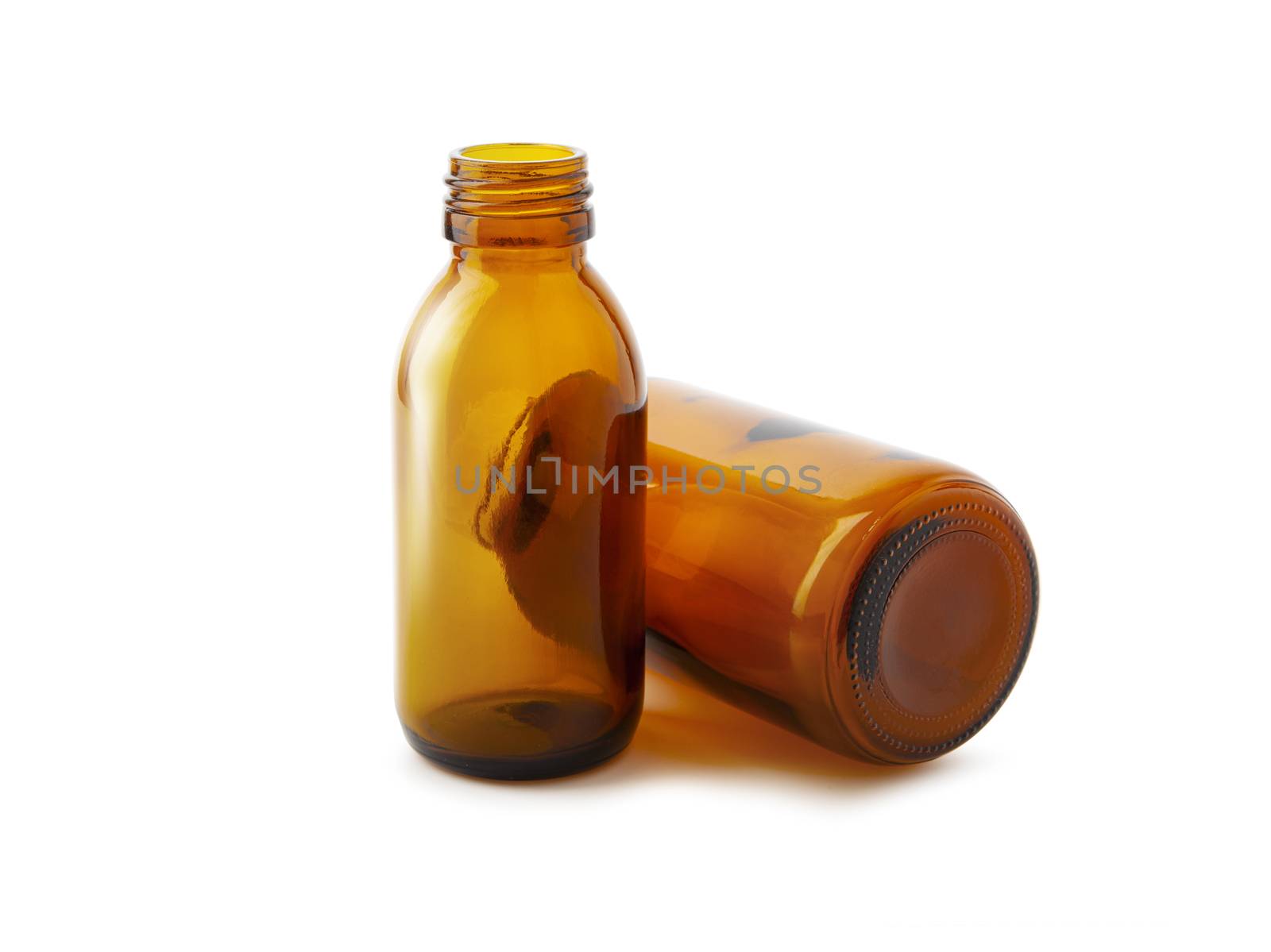 Two medicine bottles close up isolated on white background