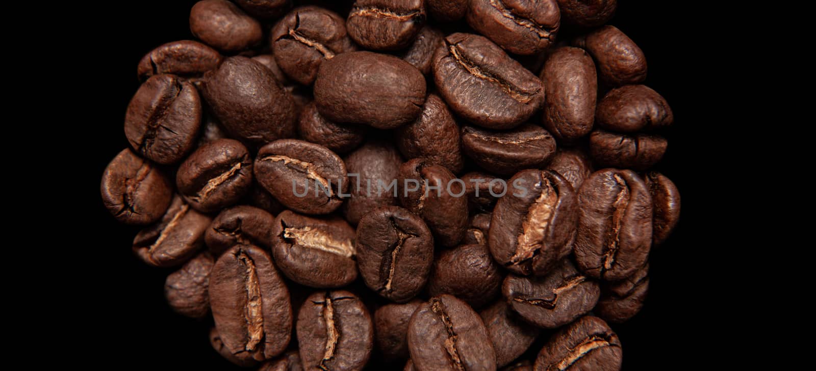 Roasted coffee beans isolated in white background cutout. Close up