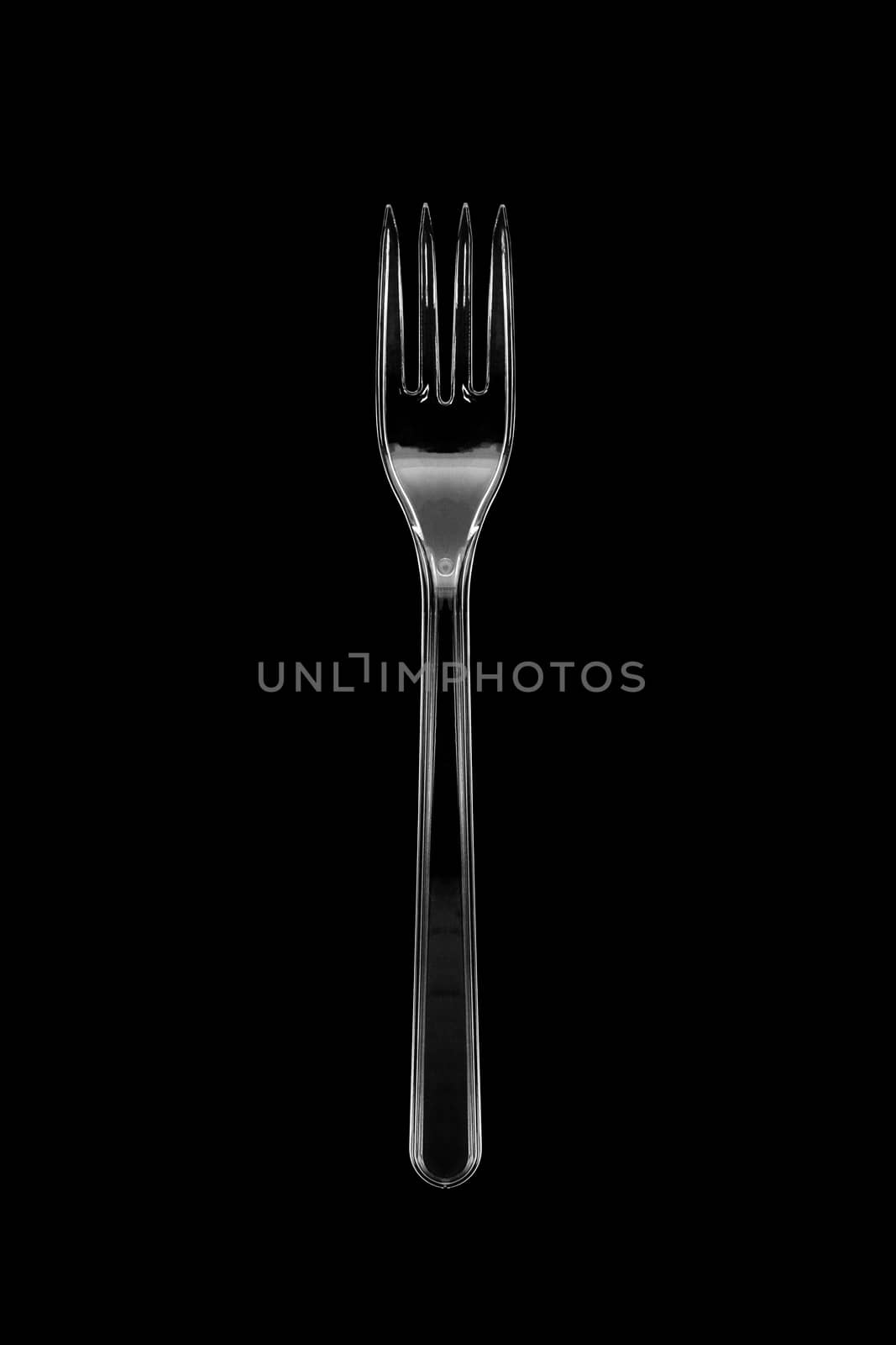 Top view of the transparent plastic fork isolated on black background. With clipping path