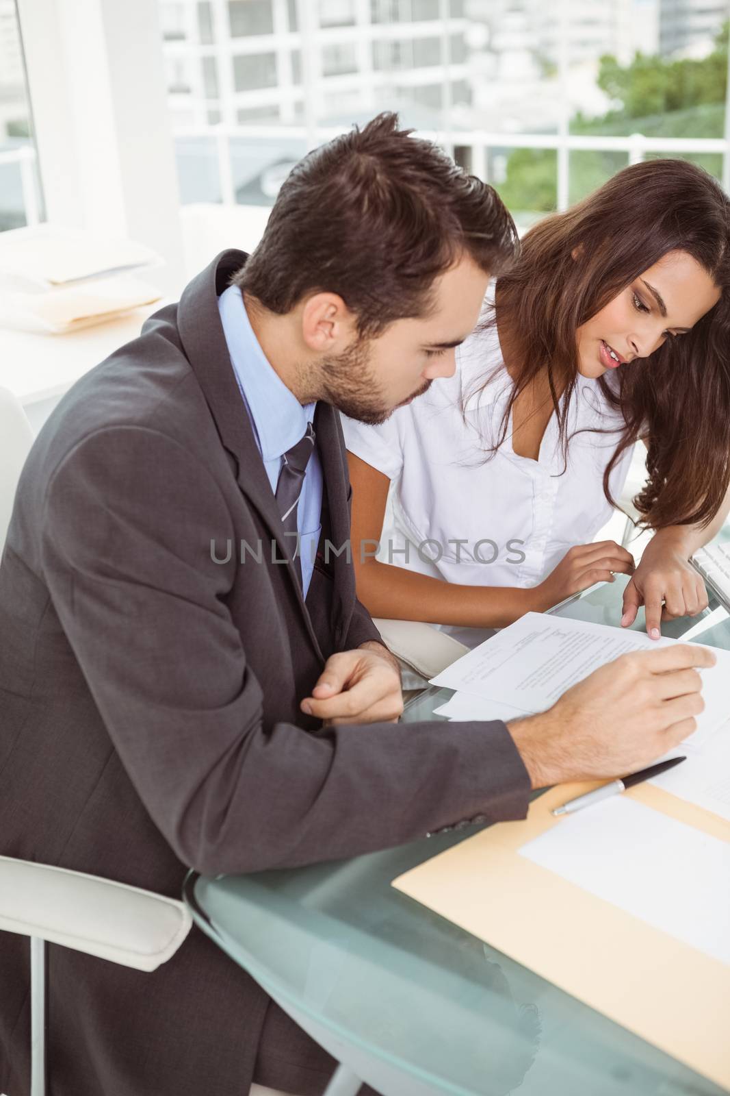 Two young business people in meeting at office