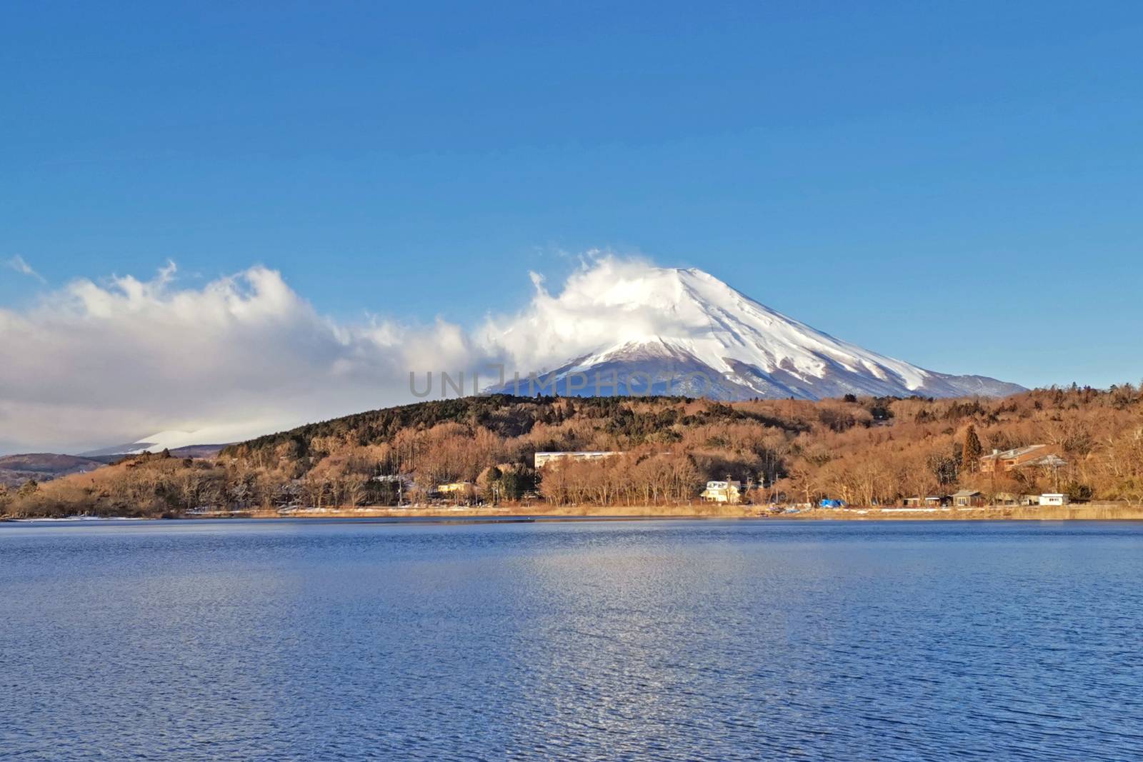 Lake, sky and Fuji mountain with snow in Japan countryside by cougarsan
