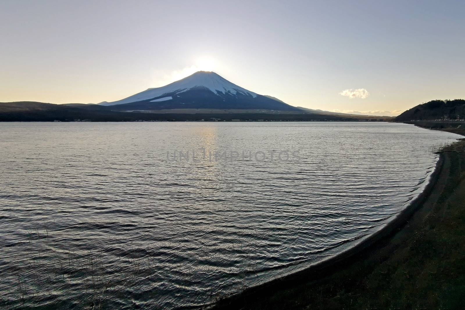 The lake, sky and Fuji mountain with snow in Japan countryside