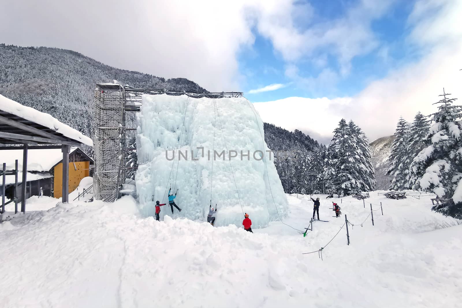 People play ice climb sport in Japan outdoor recreation center by cougarsan