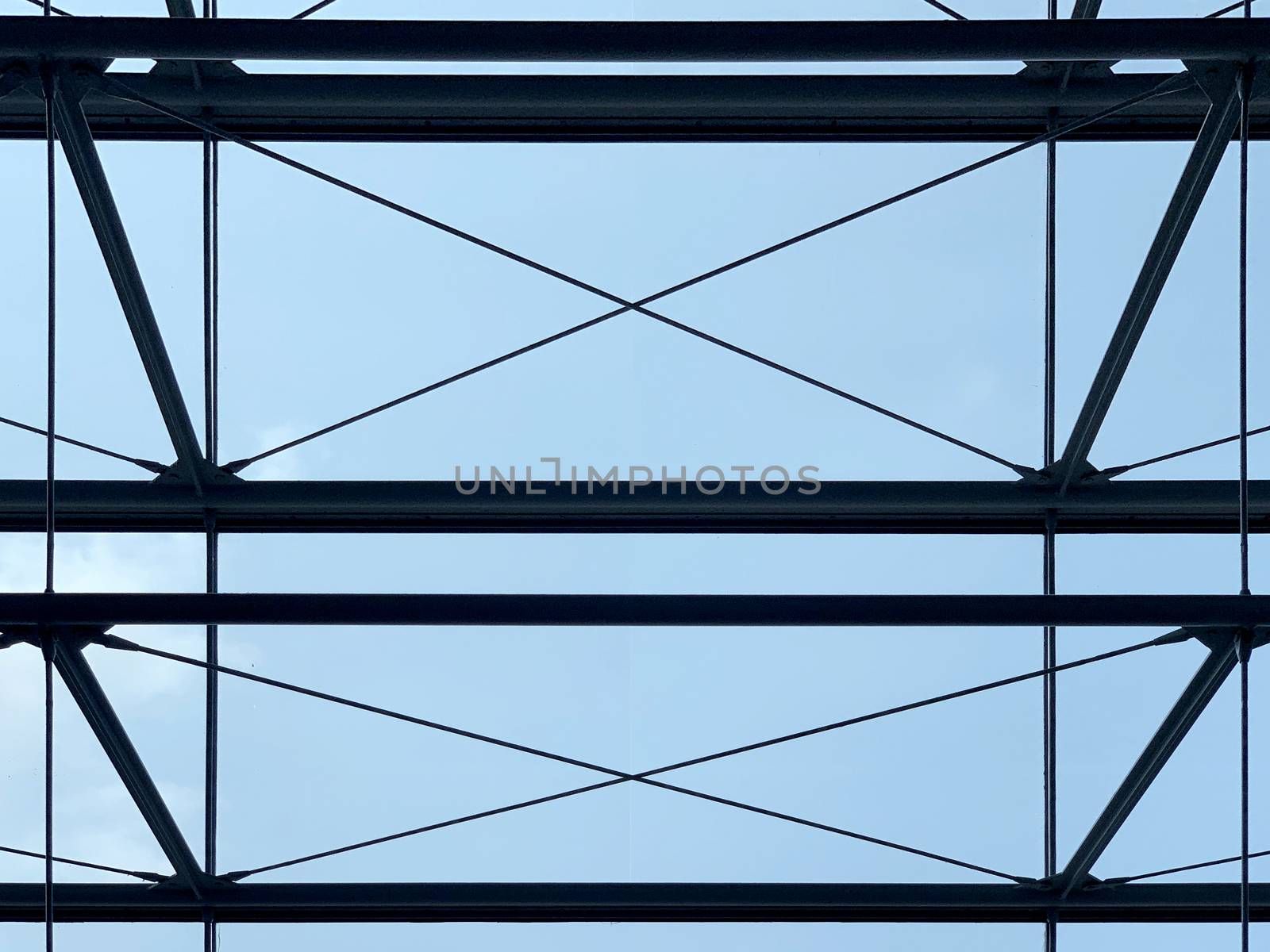 Silhouette of the indoor building with blue sky by cougarsan