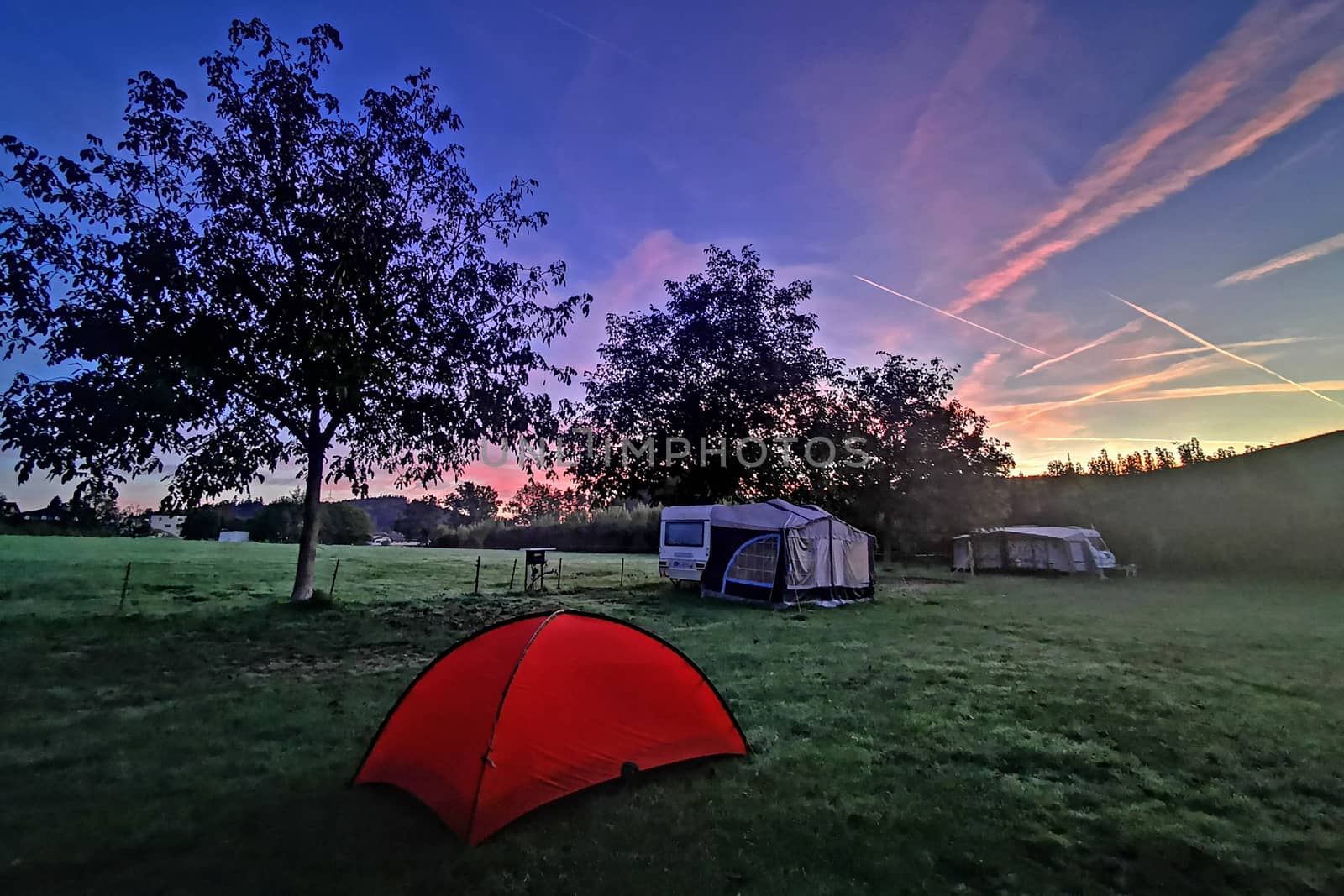 Outdoor camping tent in Switzerland countryside campsite by cougarsan