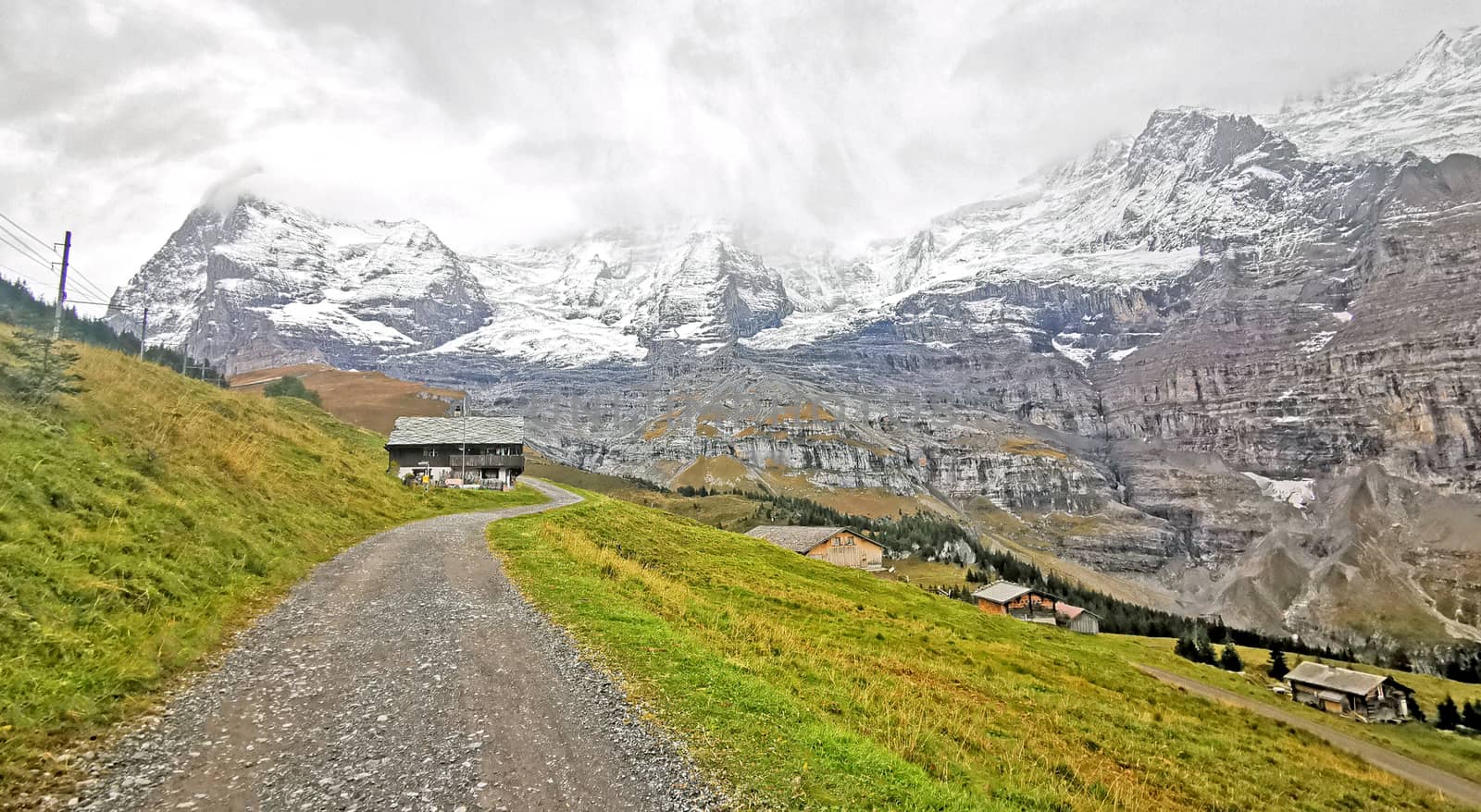 Countryside house, snow mountain, green field, footpath in Switz by cougarsan