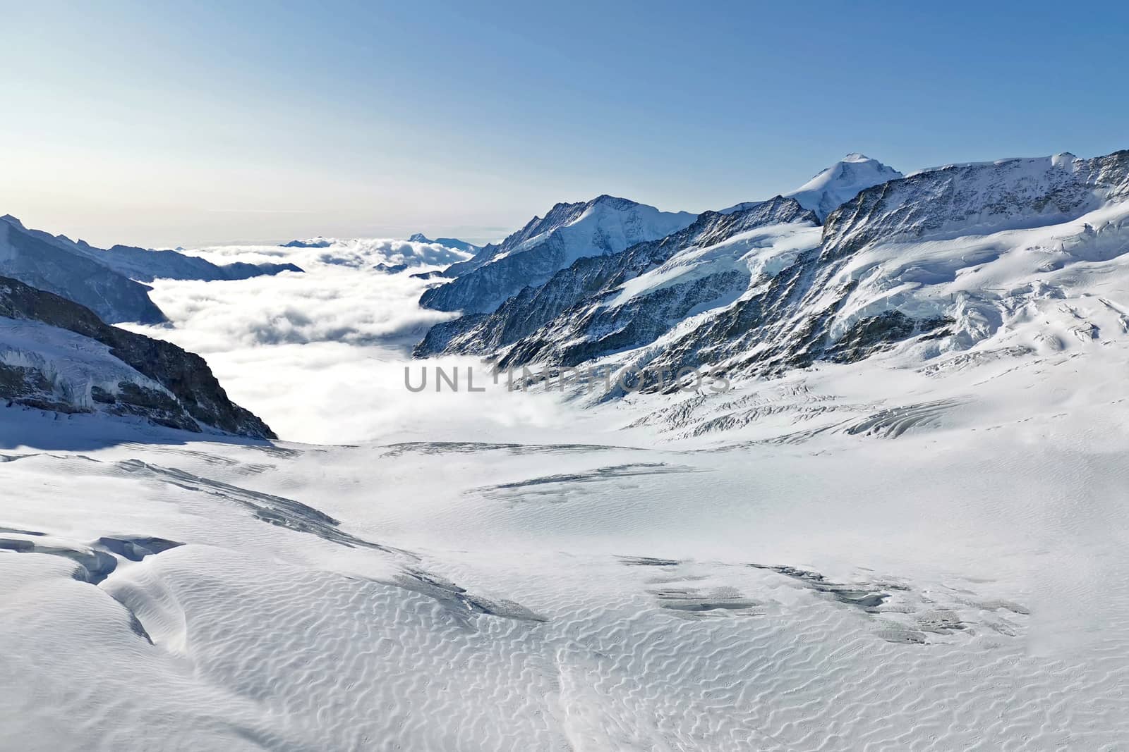 Peak of Switzerland Grindelawld snow mountain with cloud sea by cougarsan