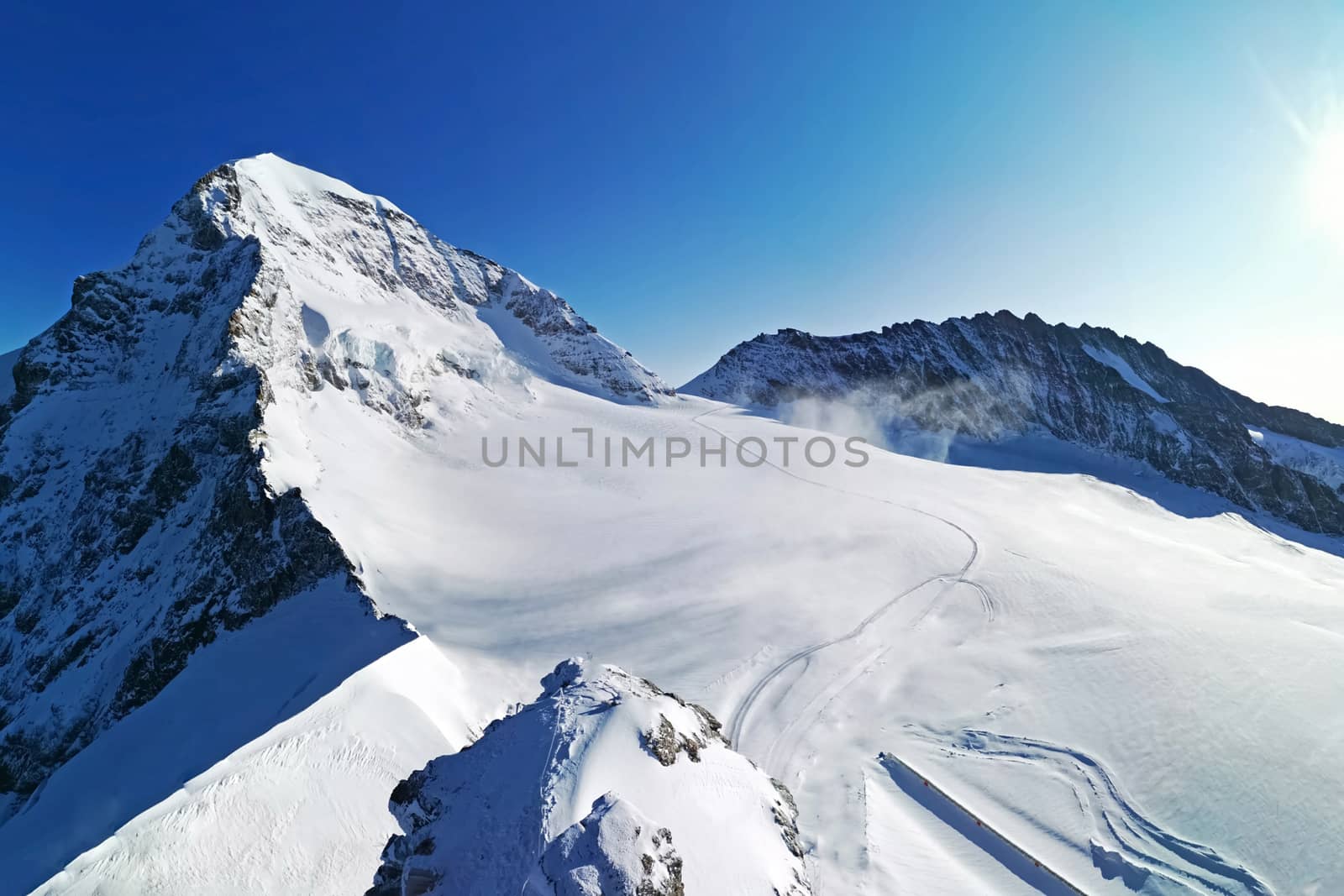 The peak of Switzerland Grindelawld snow mountain with blue sky
