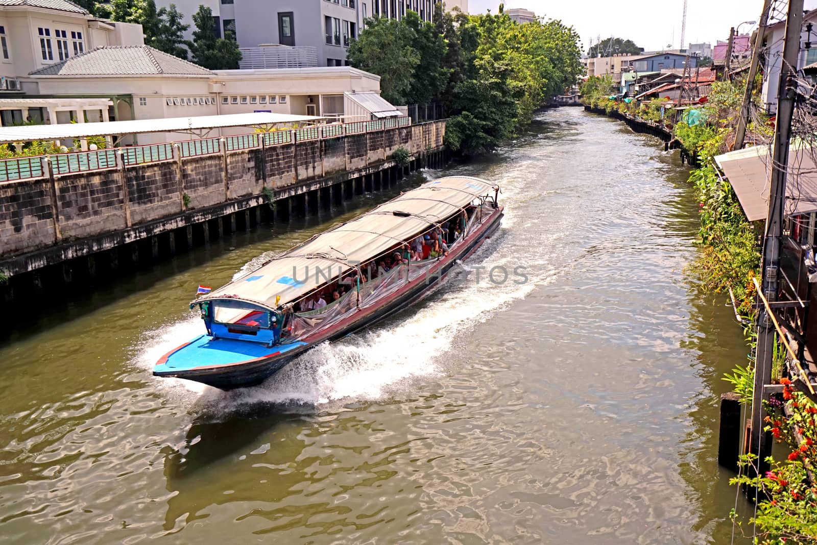 The Thailand tourist canal boat on village river at daytime