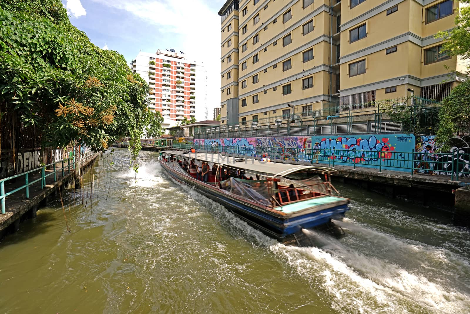 The Thailand tourist canal boat on village river at daytime