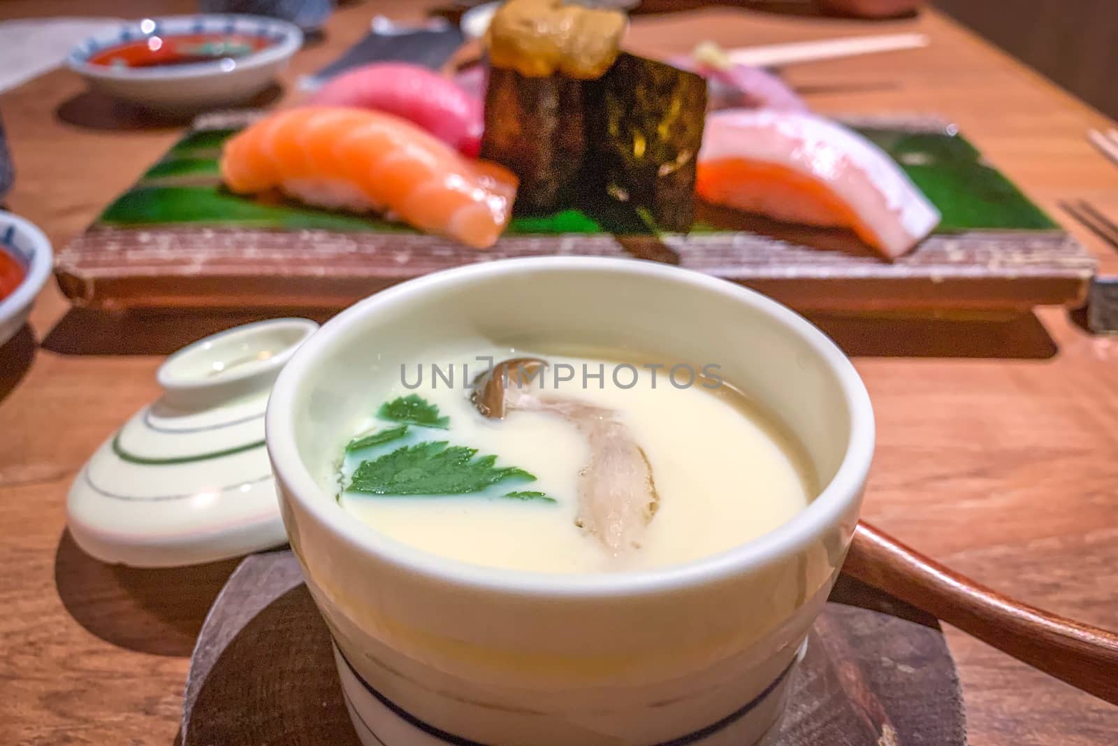 Steamed egg, sushi urchin, salmon, scallop sushi in Japanese res by cougarsan