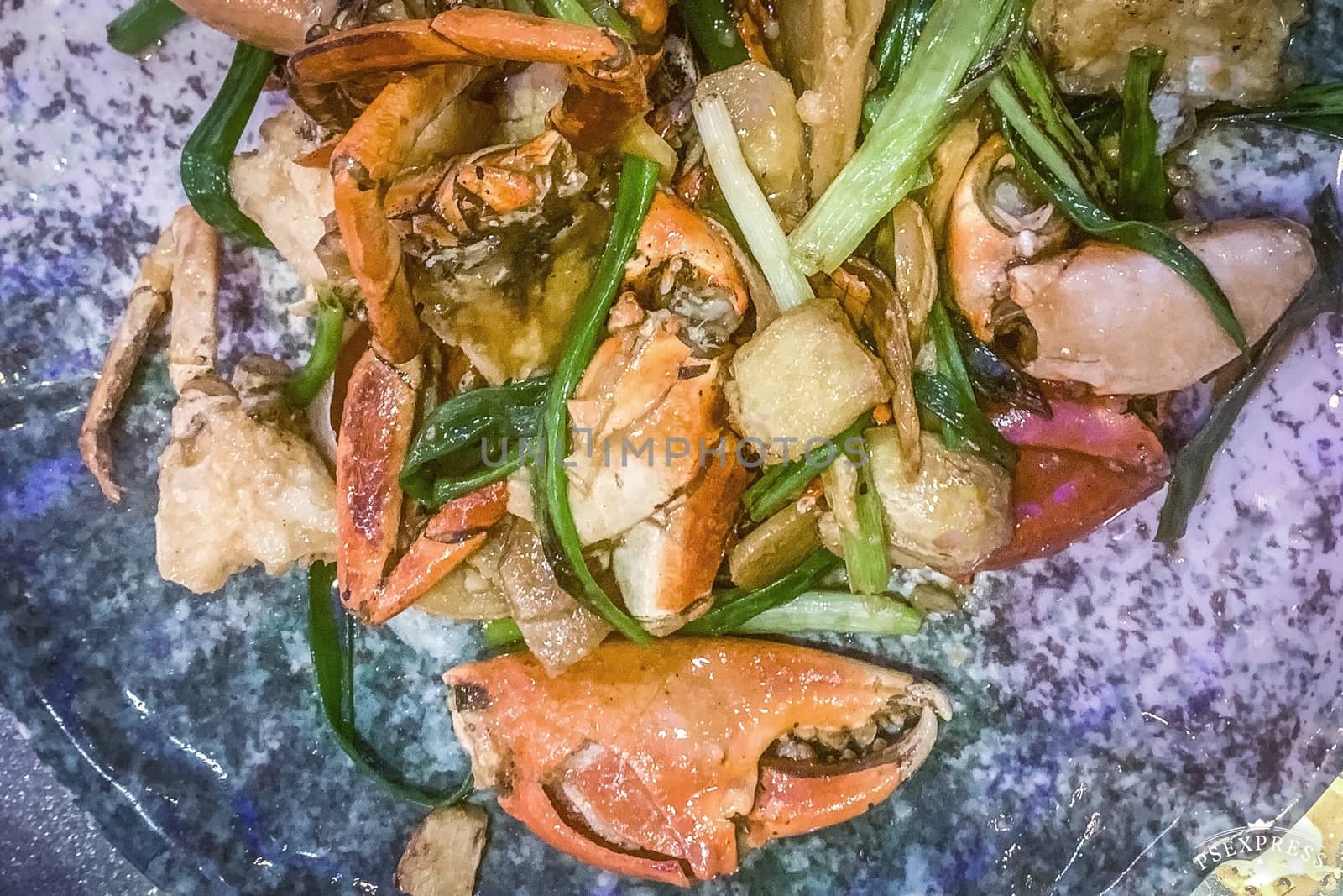 The seafood crabs with vegetable on blue dish by cougarsan