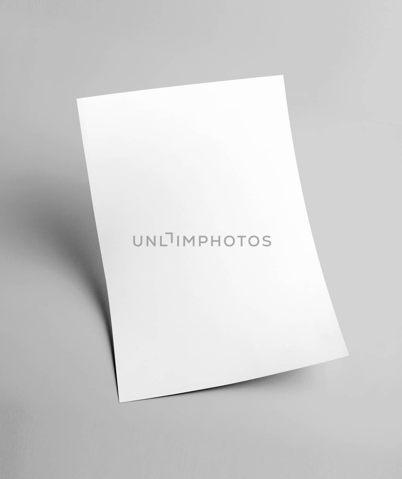 The white blank document paper template with grey background