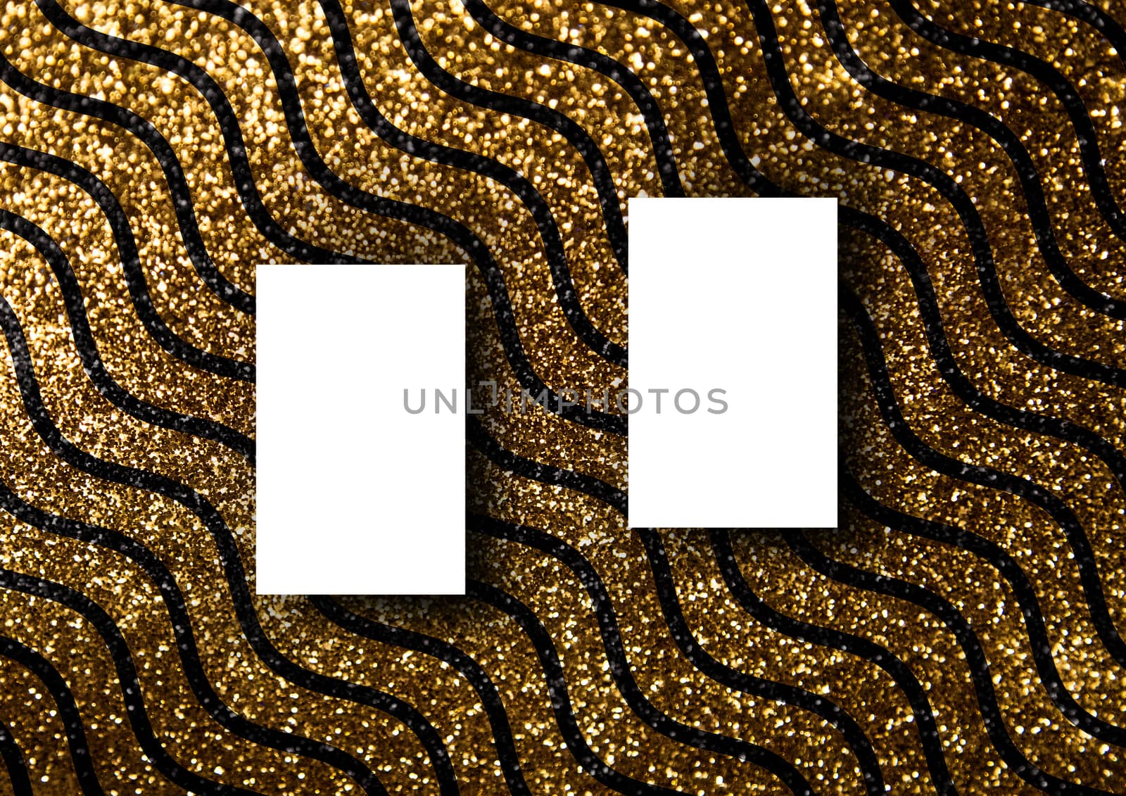 Business card mock-up template with gold wavy line pattern backg by cougarsan