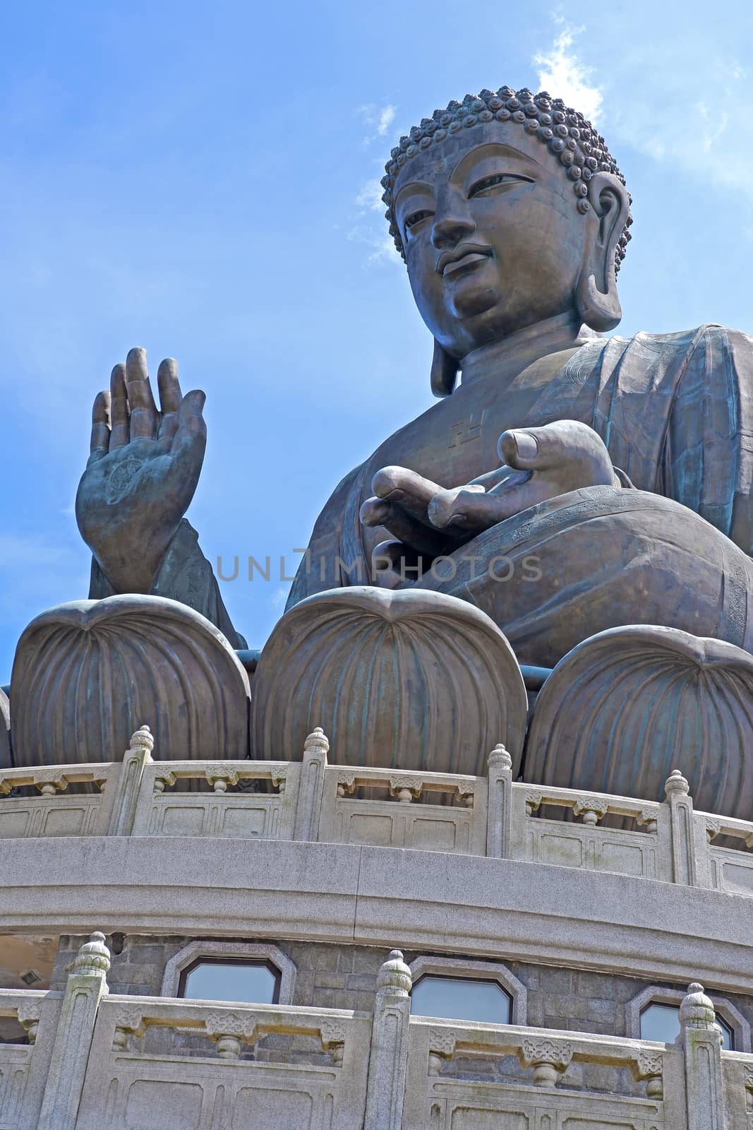 Outdoor bronze statue of  seated Tian Tan Buddha in Hong Kong by cougarsan