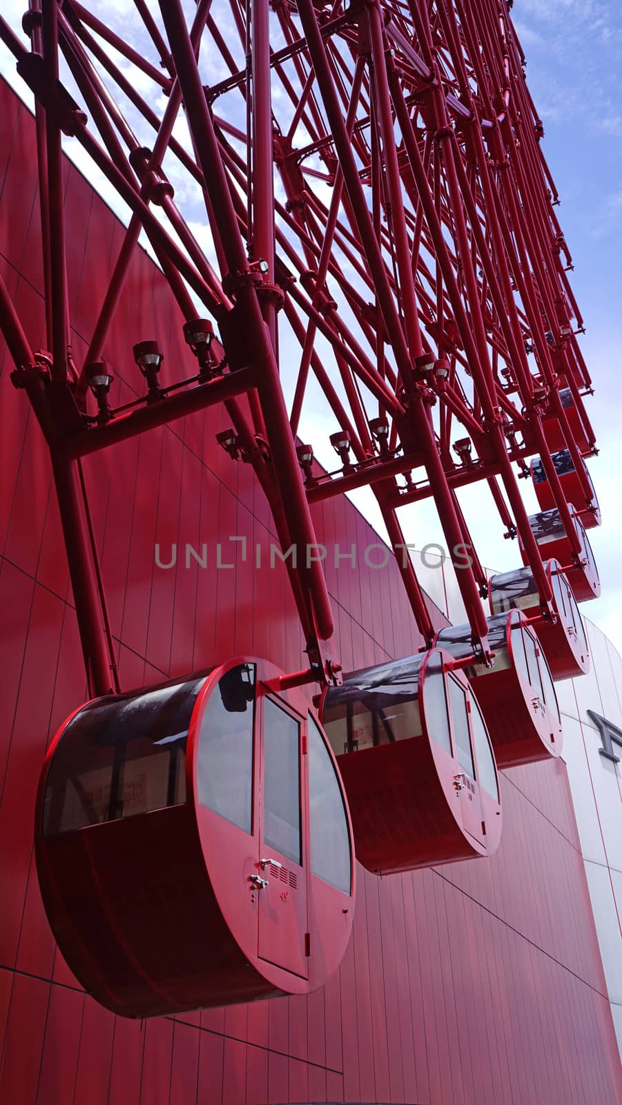 Red huge wheel ferris building in Japan Osaka by cougarsan