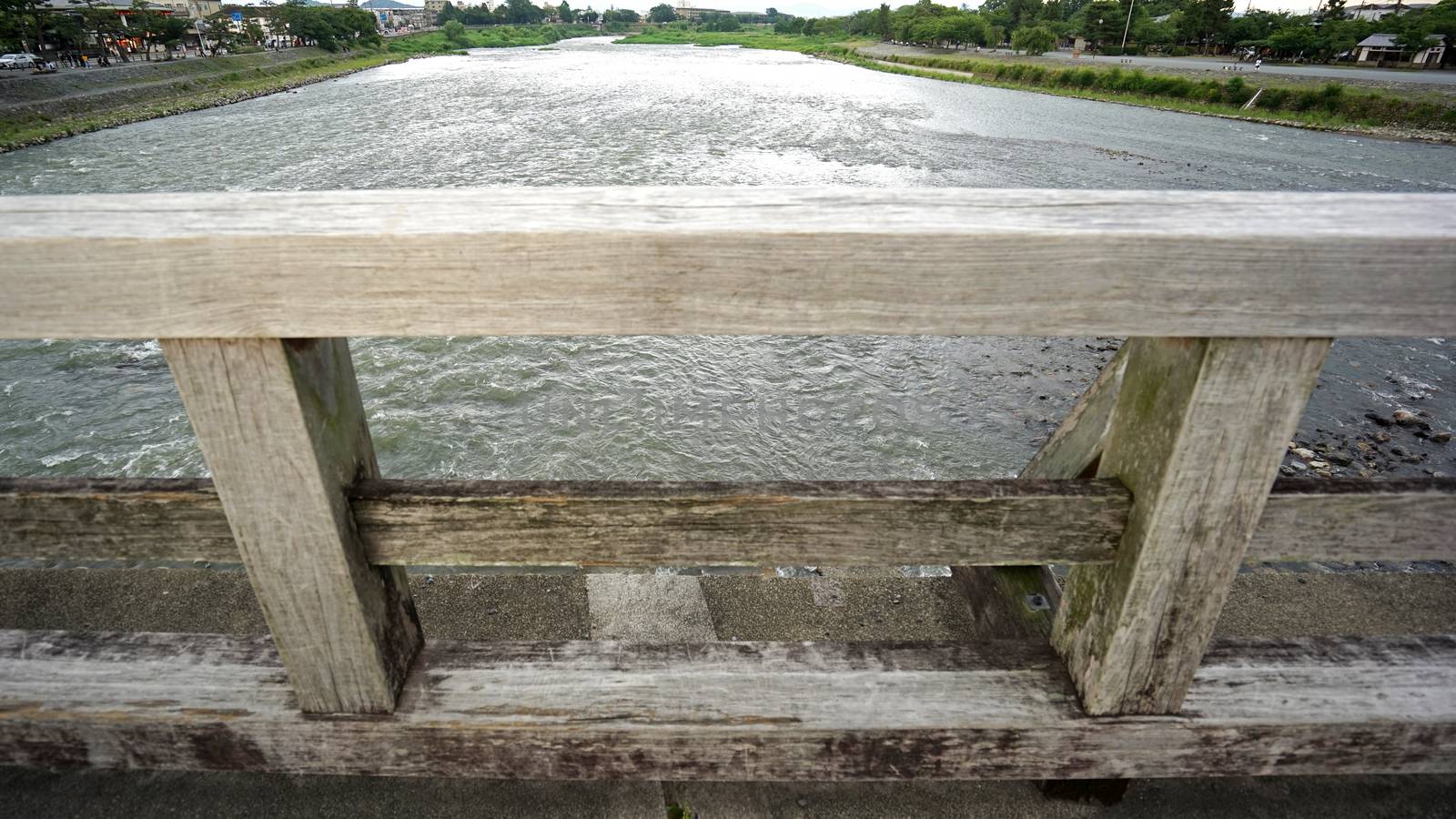 Wooden bridge, rapid river in countryside of Japan Kyoto by cougarsan