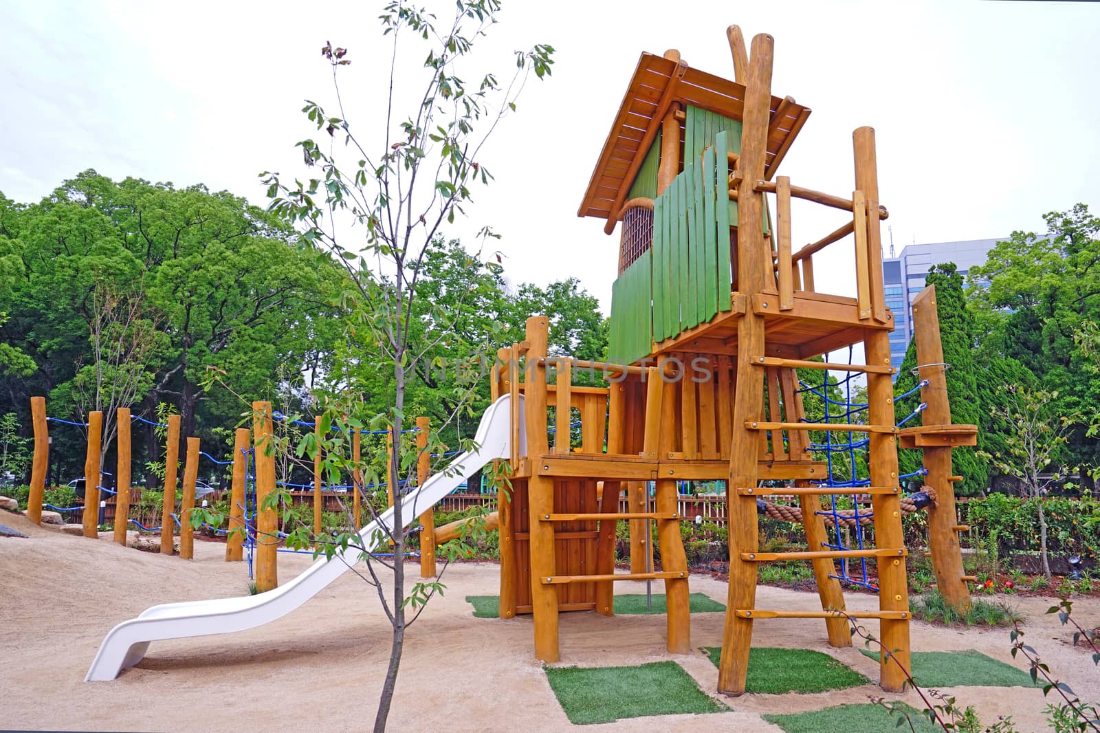 Colorful children slide equipment in Japan outdoor playround by cougarsan