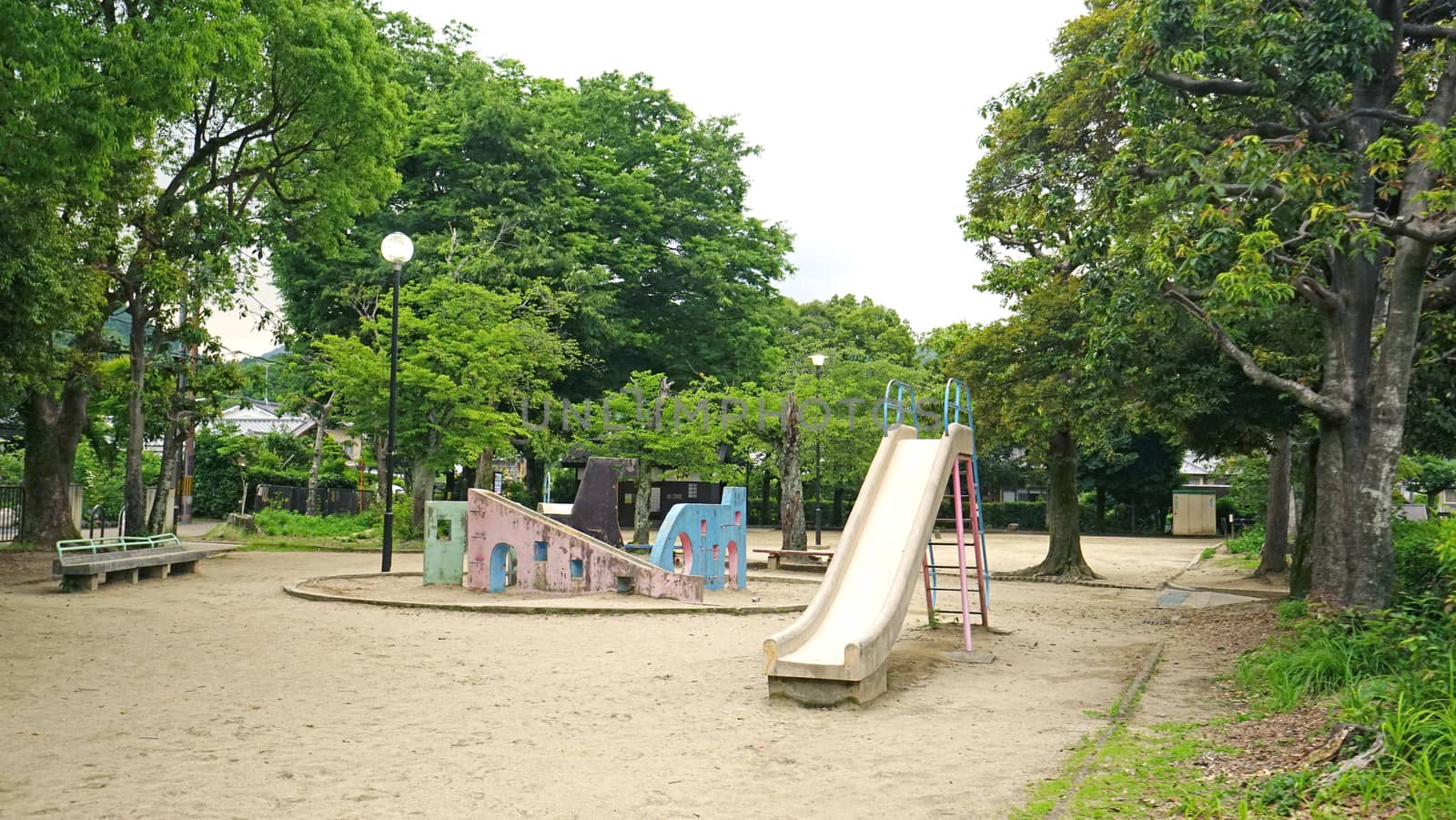 Retro children slide equipment in Japan outdoor playround by cougarsan