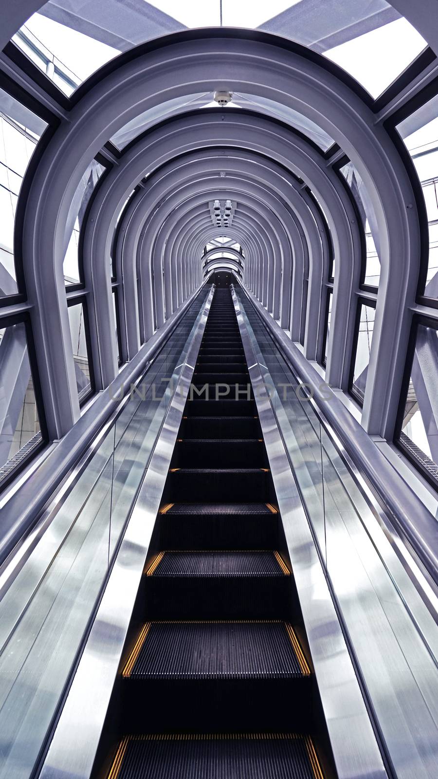 The indoor escalator, window, interior in architectural building from perspertive view