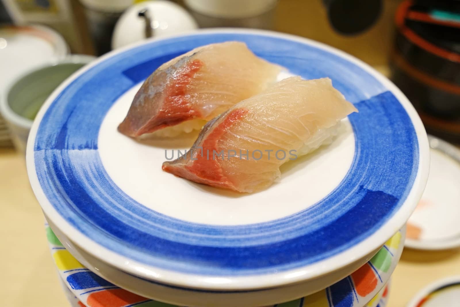 The KAMASU NIGIRI sushi on white dish in Japanese restuarant