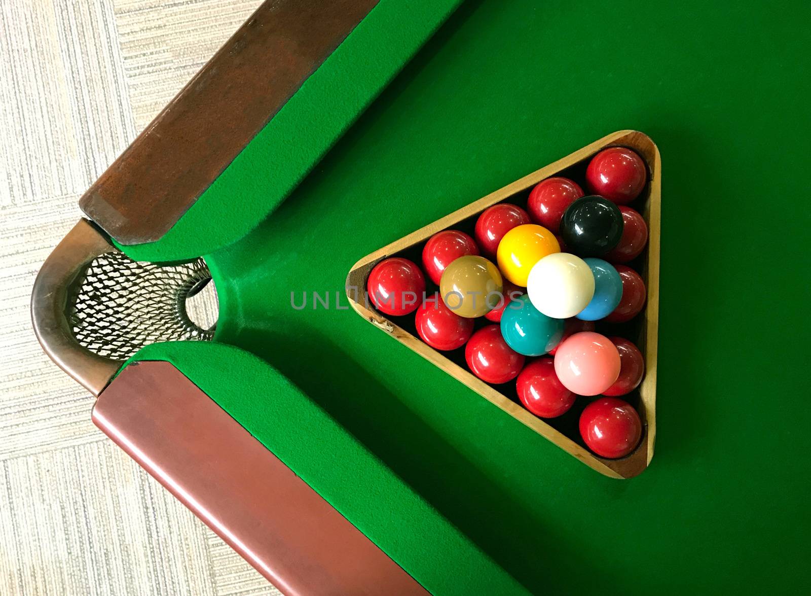 snooker balls on the green game table top view