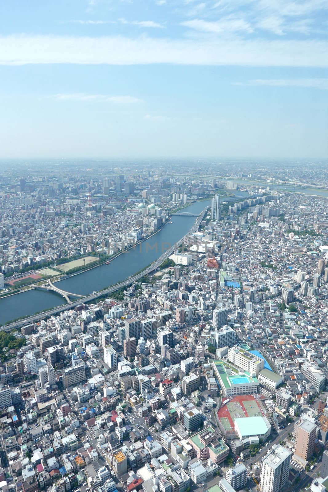 Japan Tokyo cityscape, river, commercial and residential building from aerial view