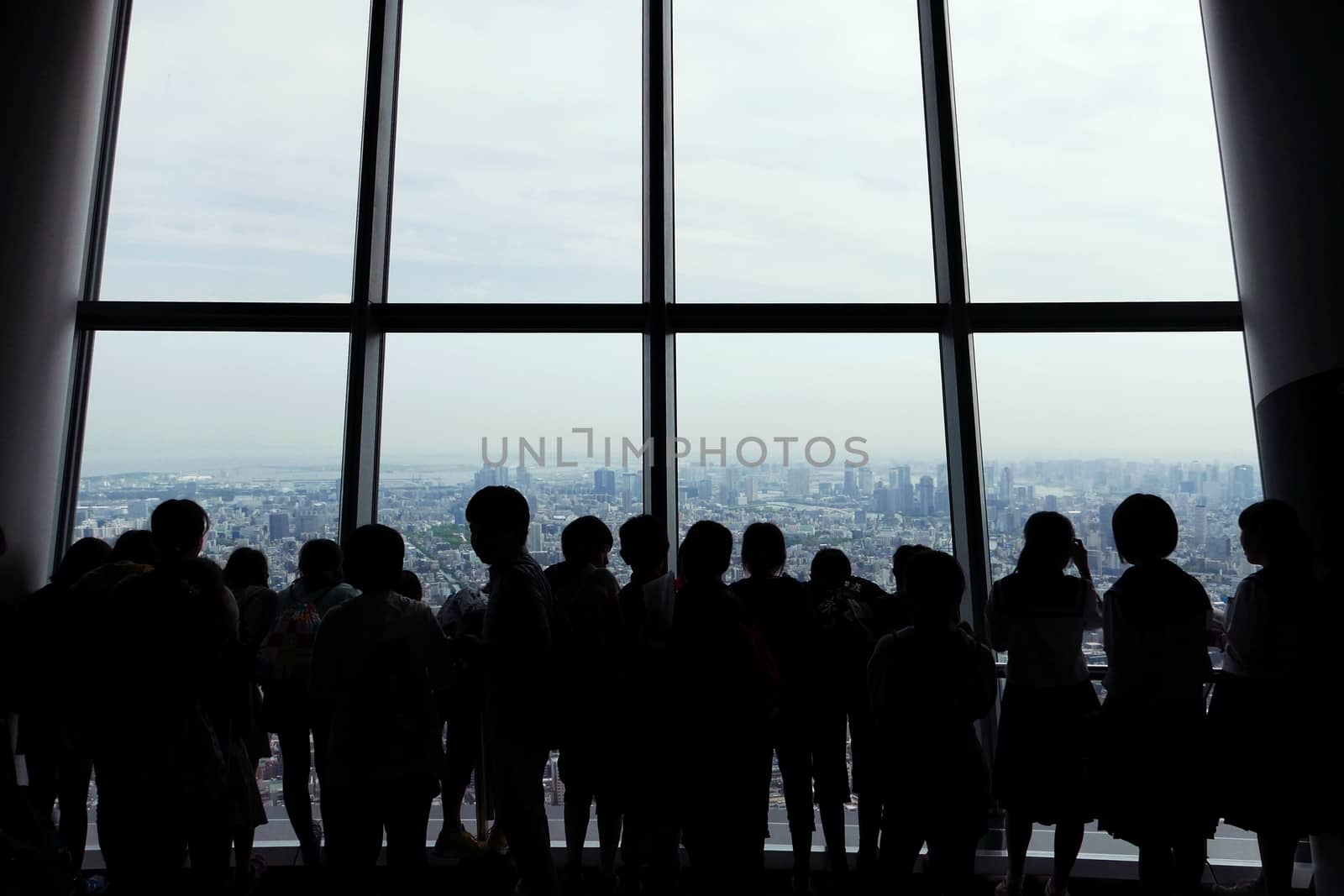 The silhouette of sightseeing people with Japan cityscape background