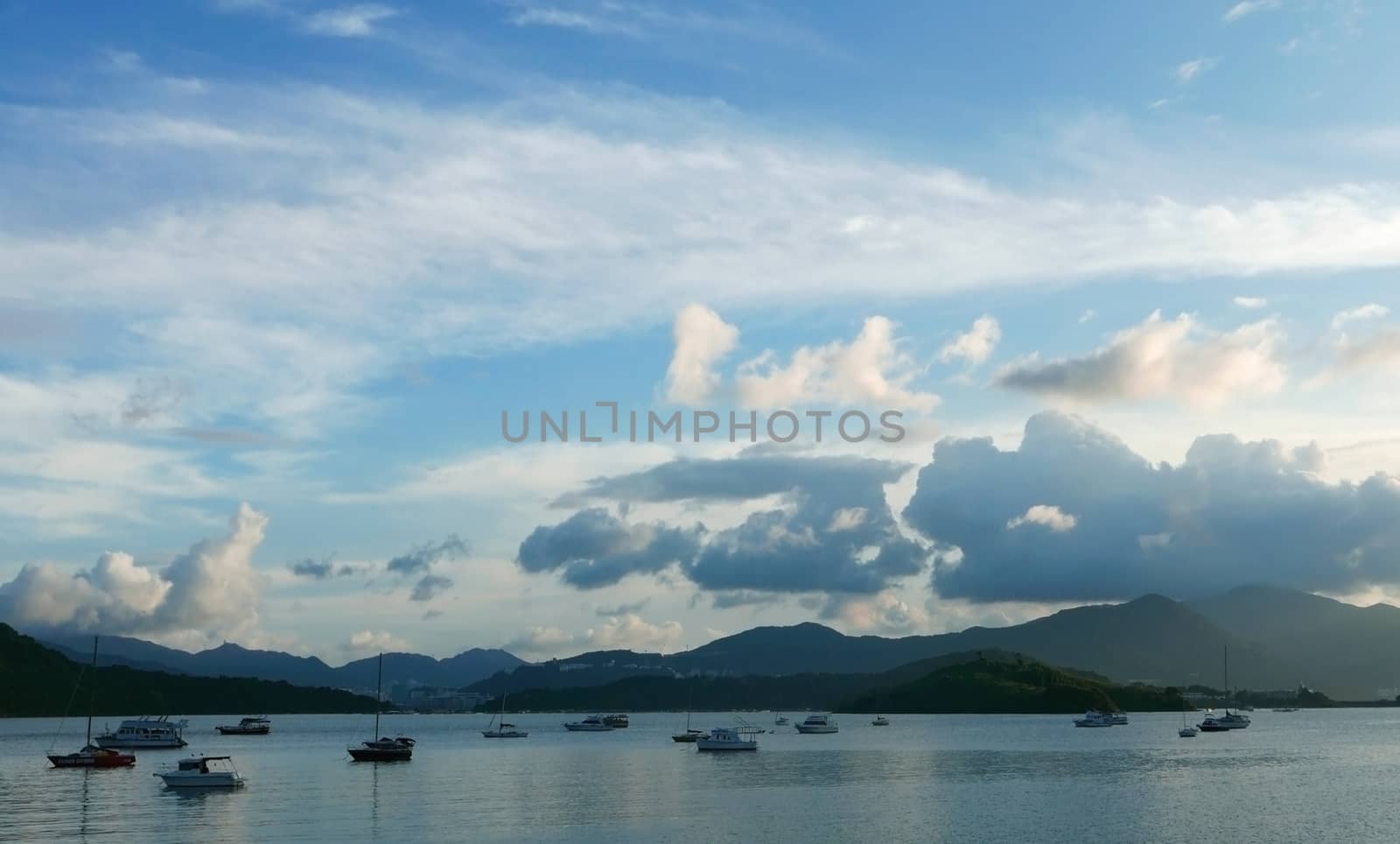 Motorboat, lake, mountain and the blue sky