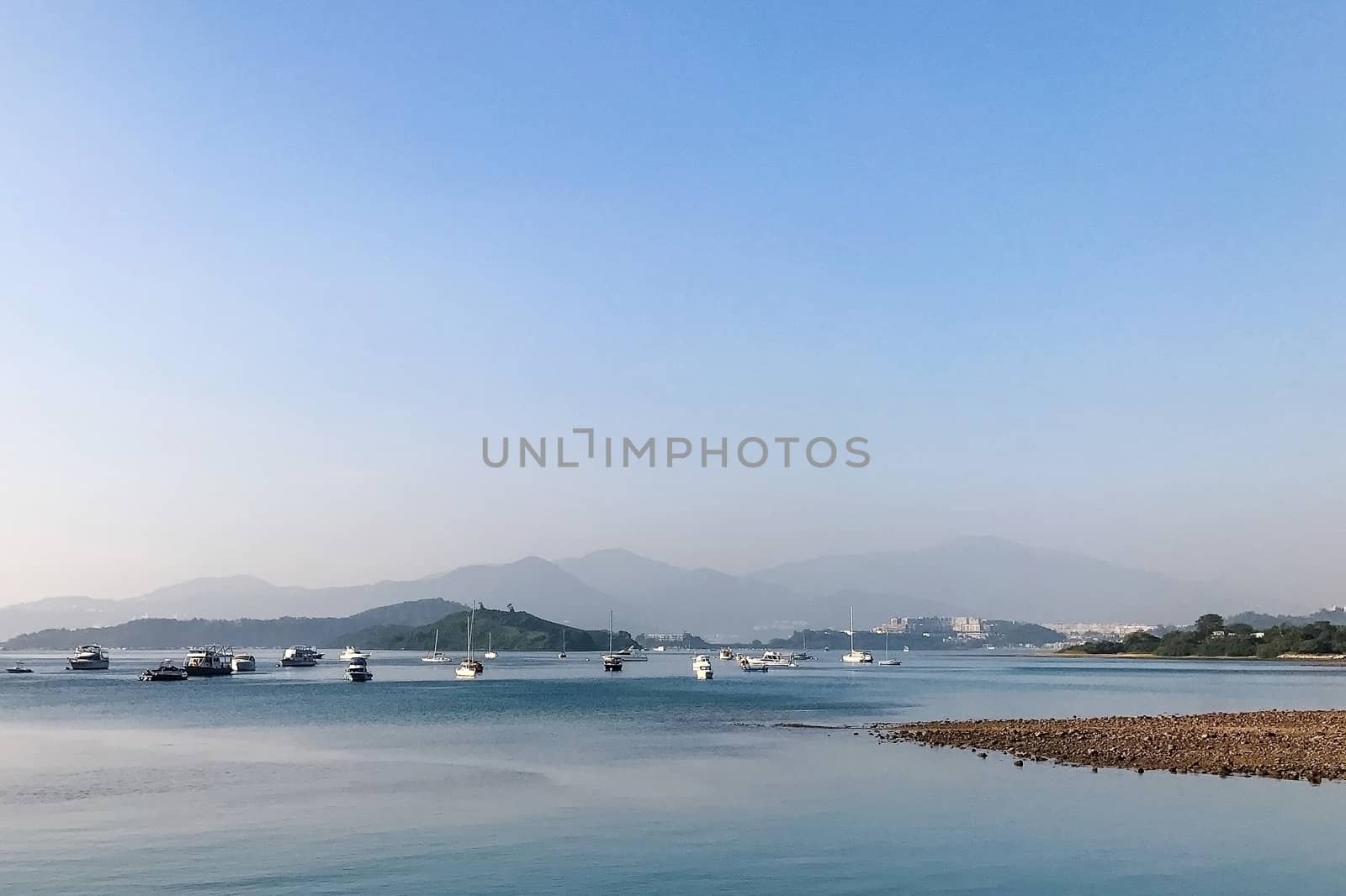 blue sky, white mountain, tree and the boat