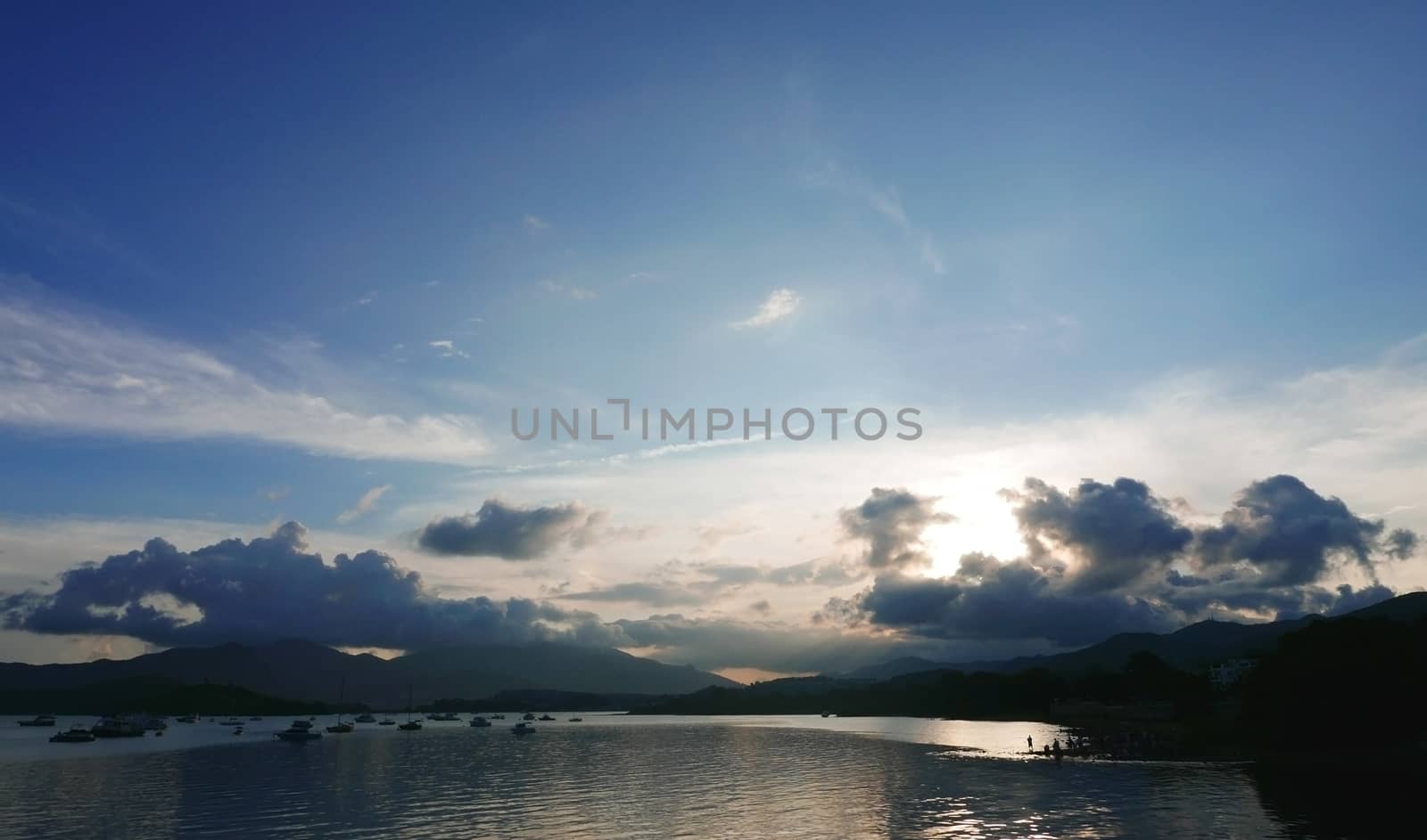 Motorboat, lake, mountain and the cloudscape by cougarsan