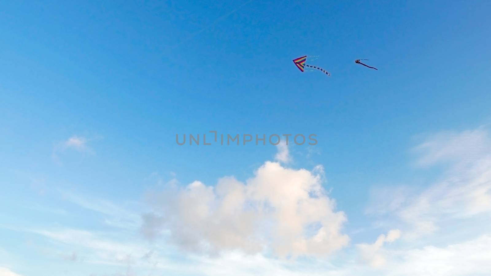 Cloud, blue sky with two flying kites  by cougarsan