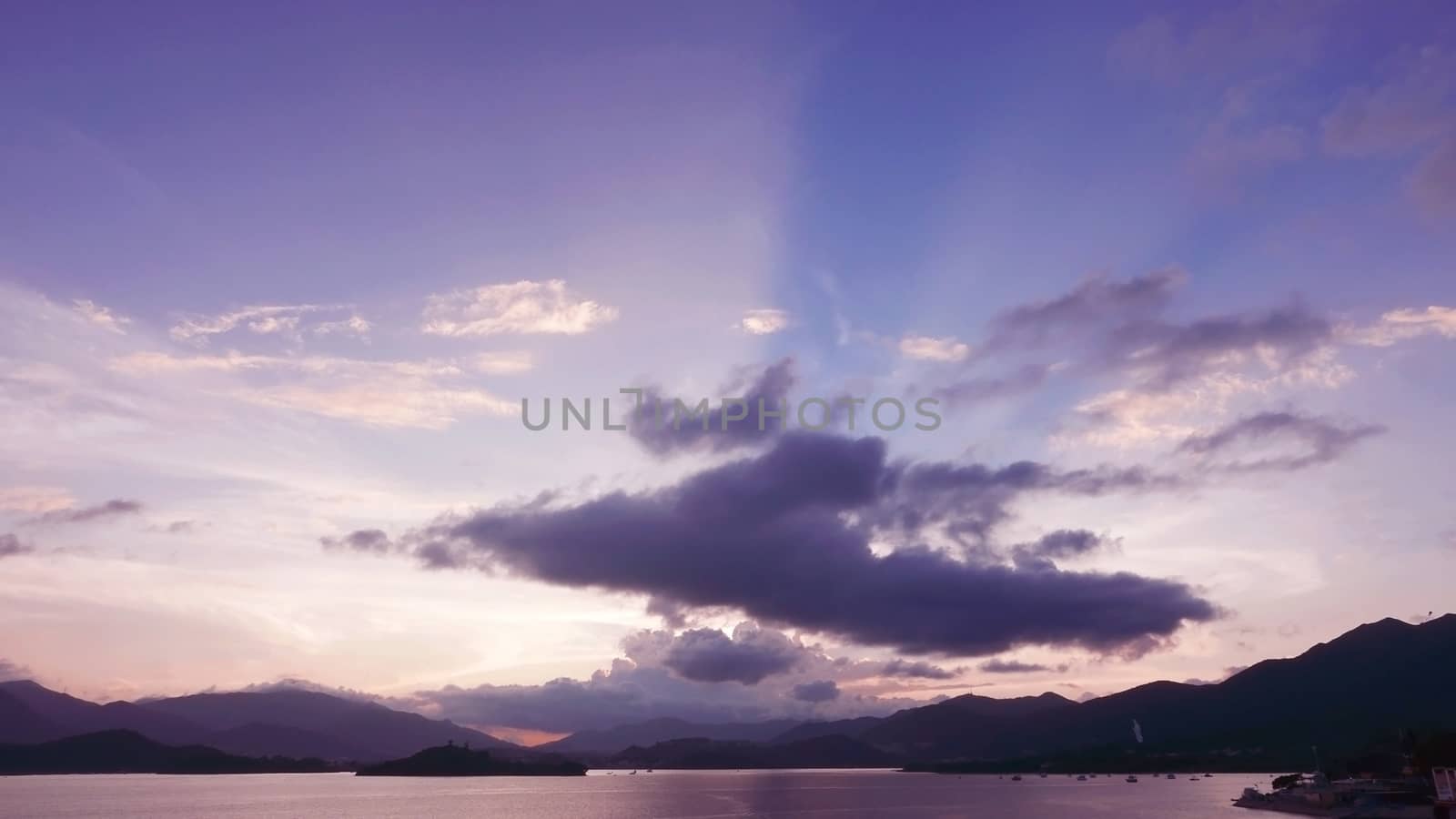 mountain, dramatic sky and sea at sunset