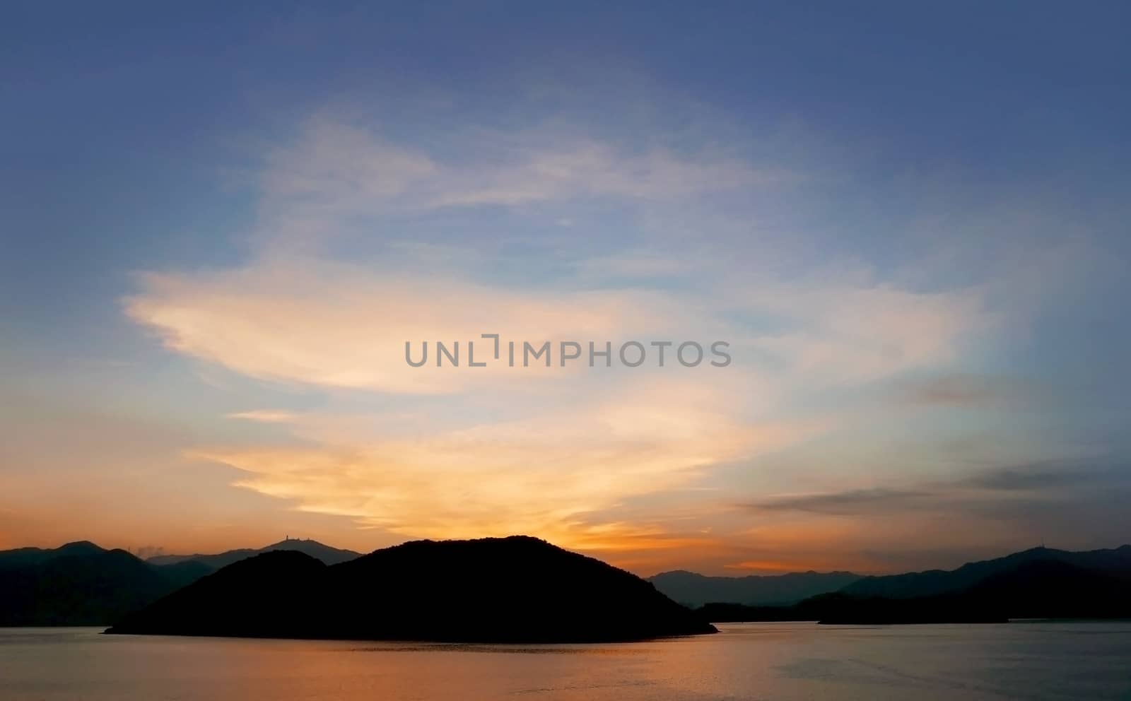 Mountain, ocean, cloud and the gradient sky at sunset