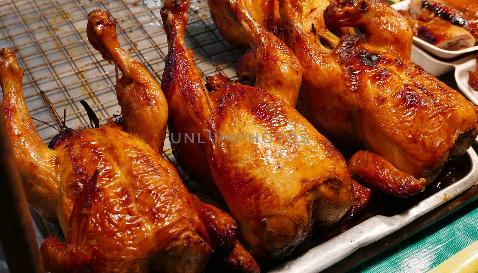 Roast chicken selling at Thailand night food market by cougarsan