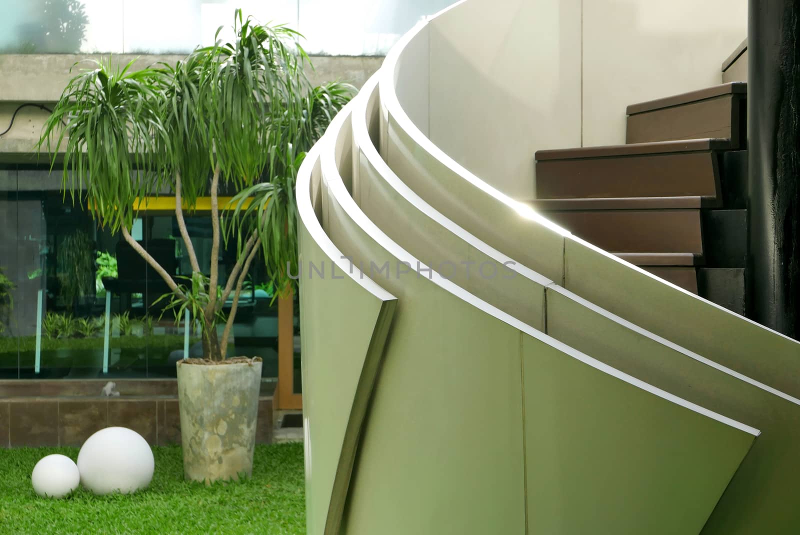 backyard and modern curve staircase outside the building