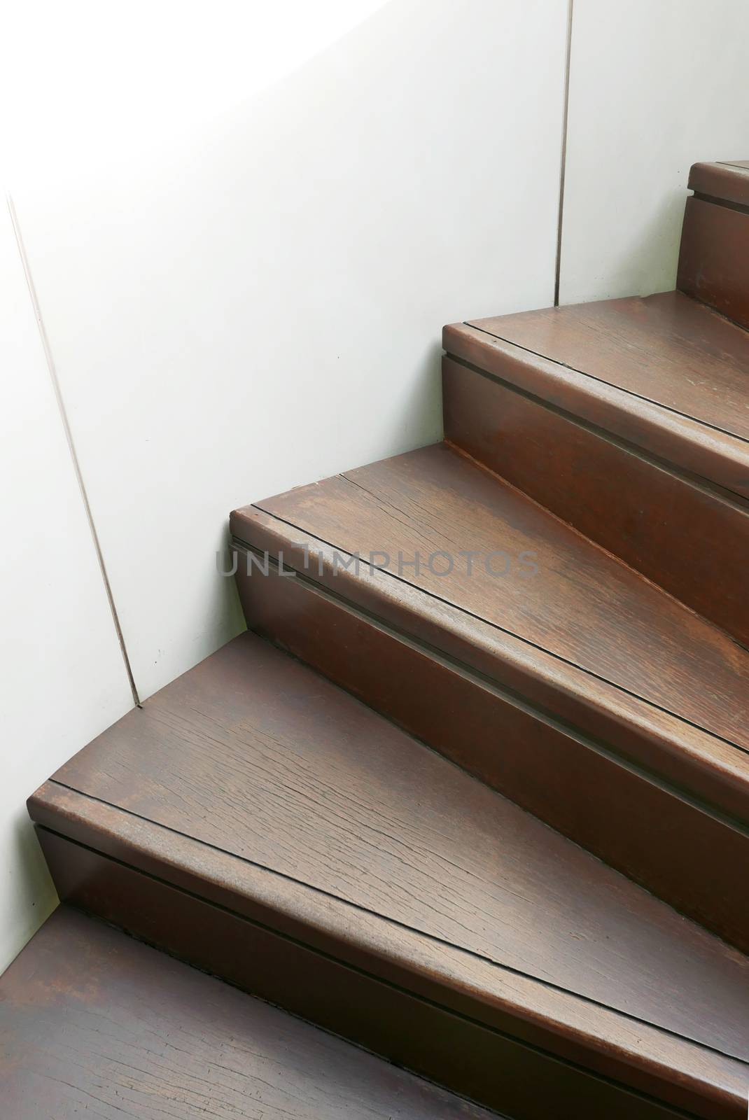 Closeup wooden curve staircase in building by cougarsan