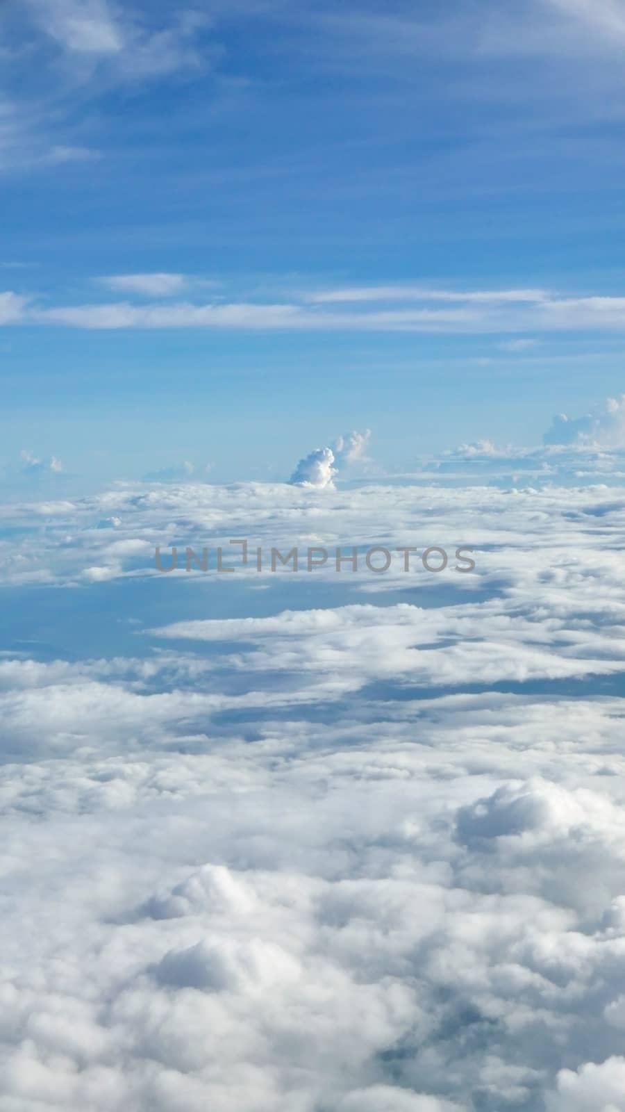 Vertical blue sky cloudscape background from aerial view by cougarsan