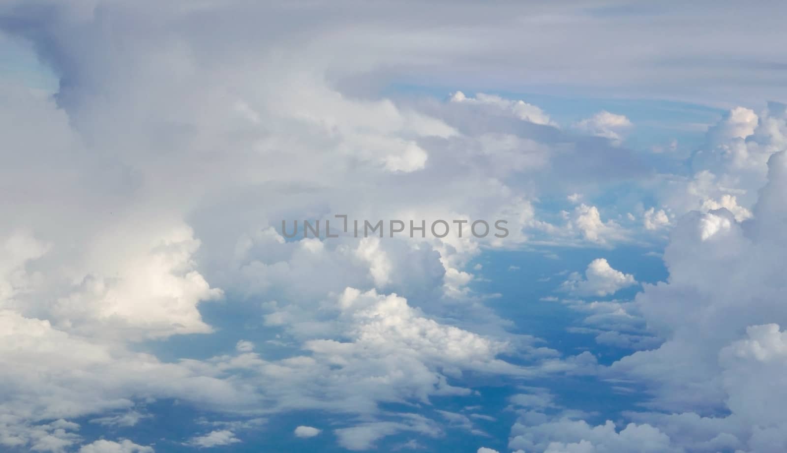 Blue sky cloudscape background from aerial view by cougarsan