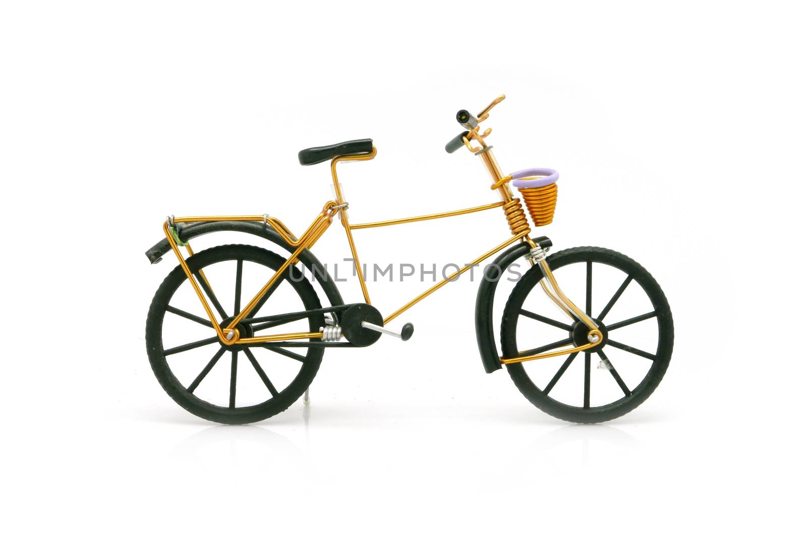 vintage gold bicycle model for decoration on white background