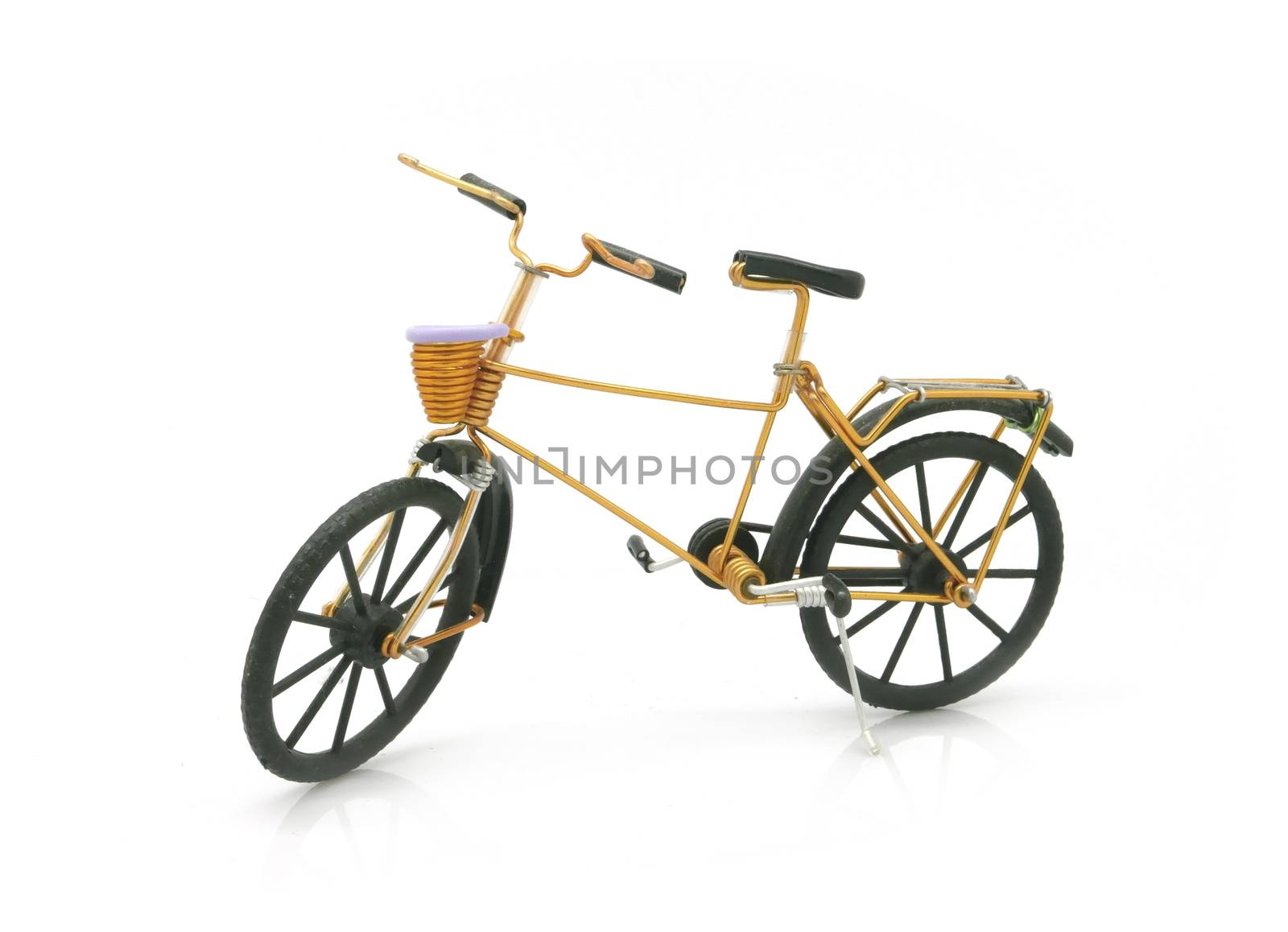 vintage gold bicycle model for decoration on white background by cougarsan