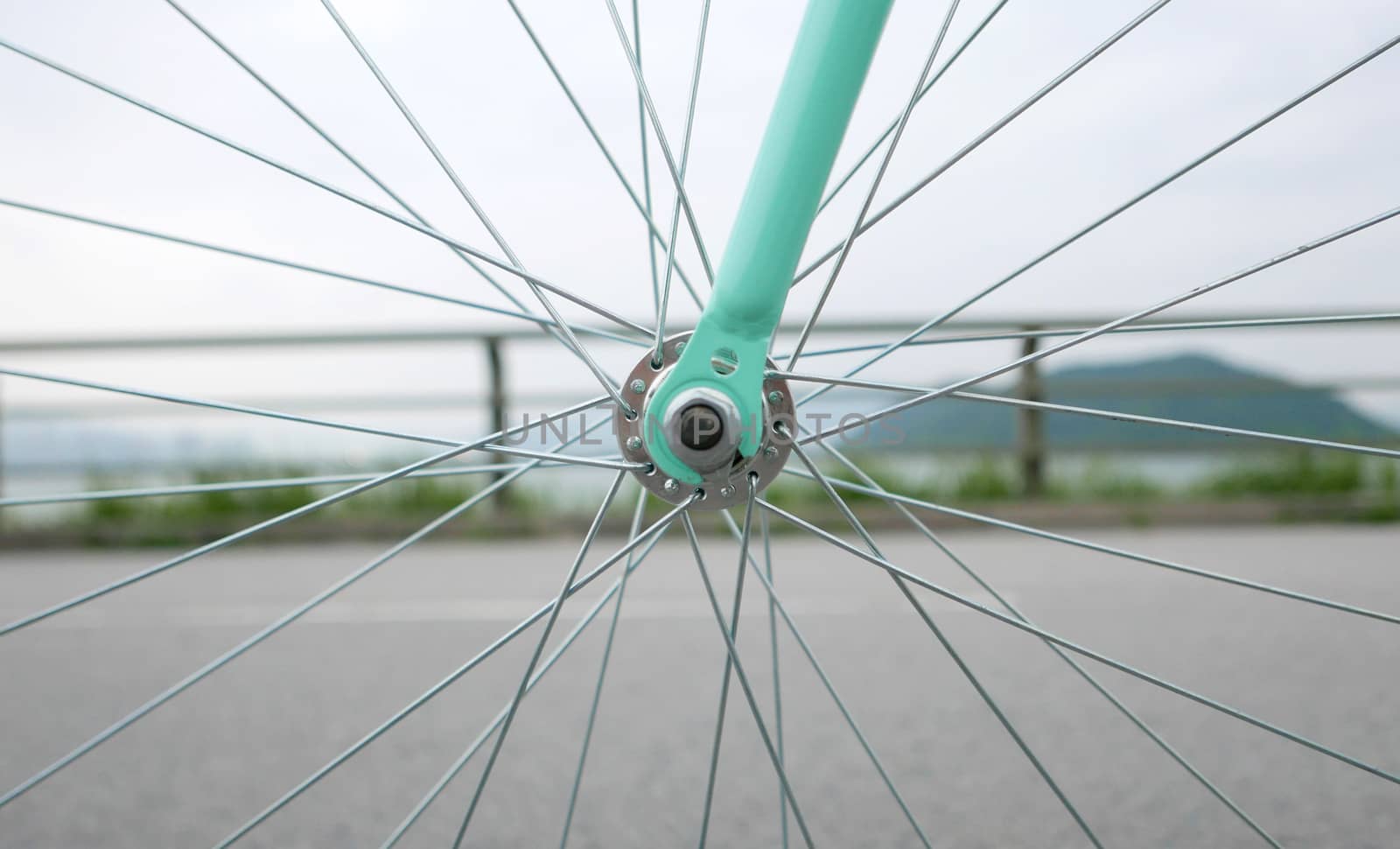 part of mint green retro bicycle and rim closeup by cougarsan