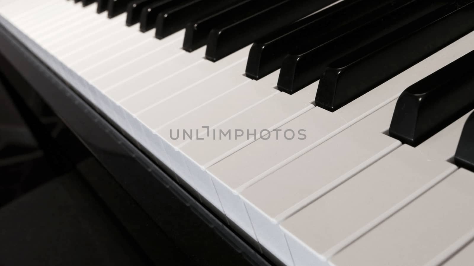 Keyboard of piano close-up, focus at the front